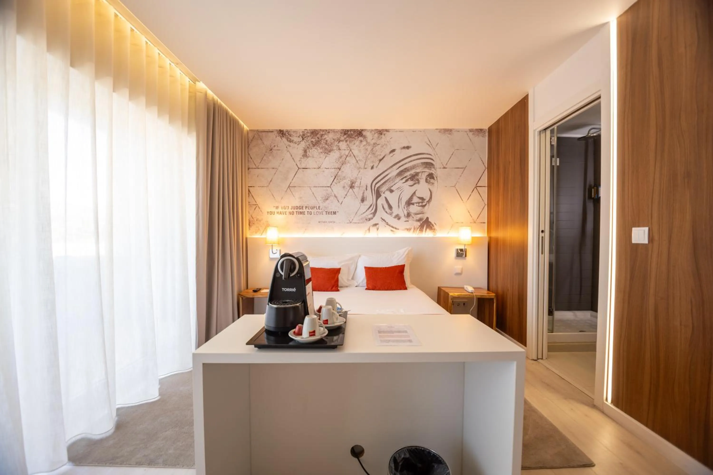 Bed in The ICONS Lisbon Hotel