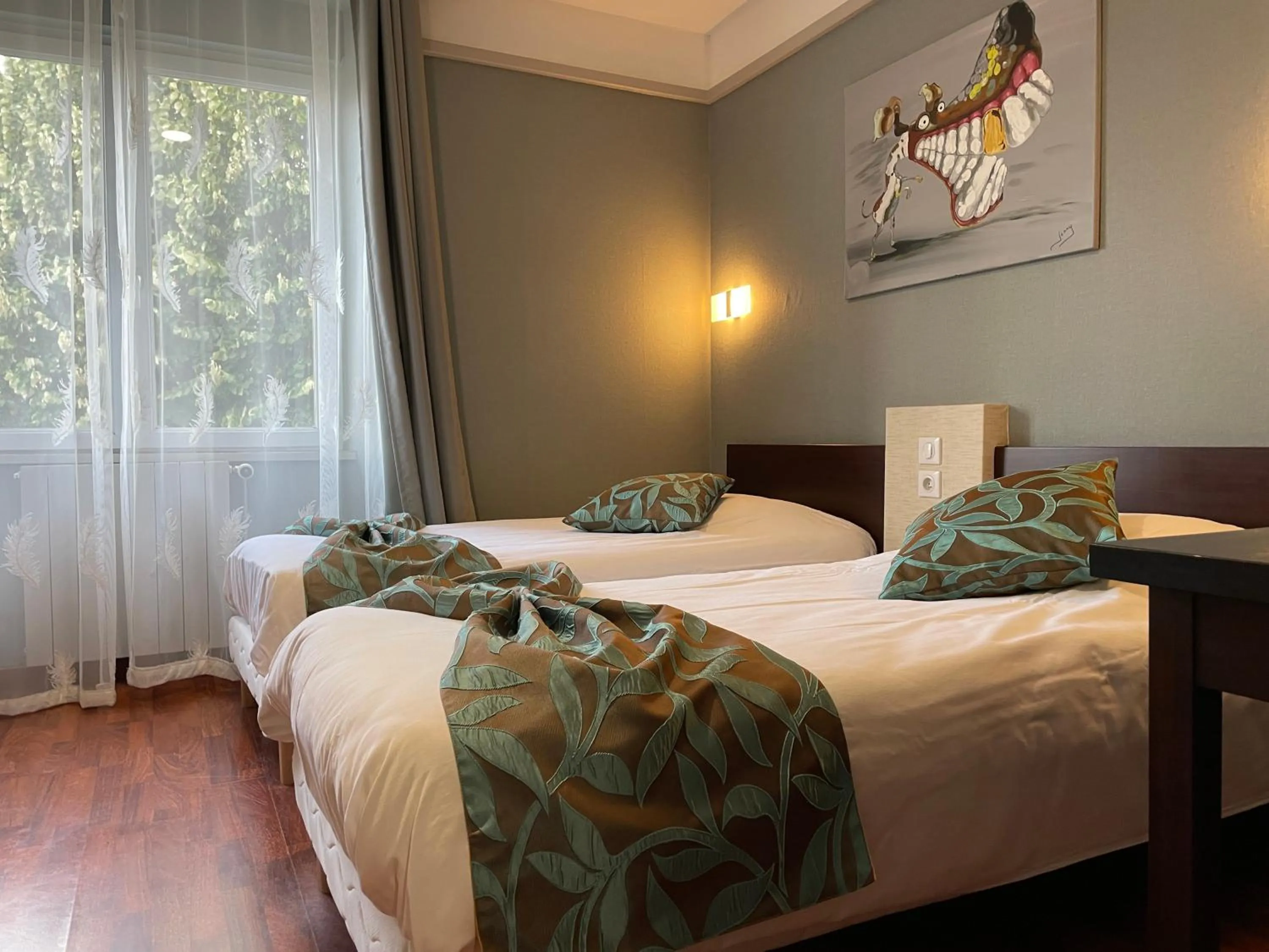 Bed in L'EMBLEME - BOUTIQUE HOTEL