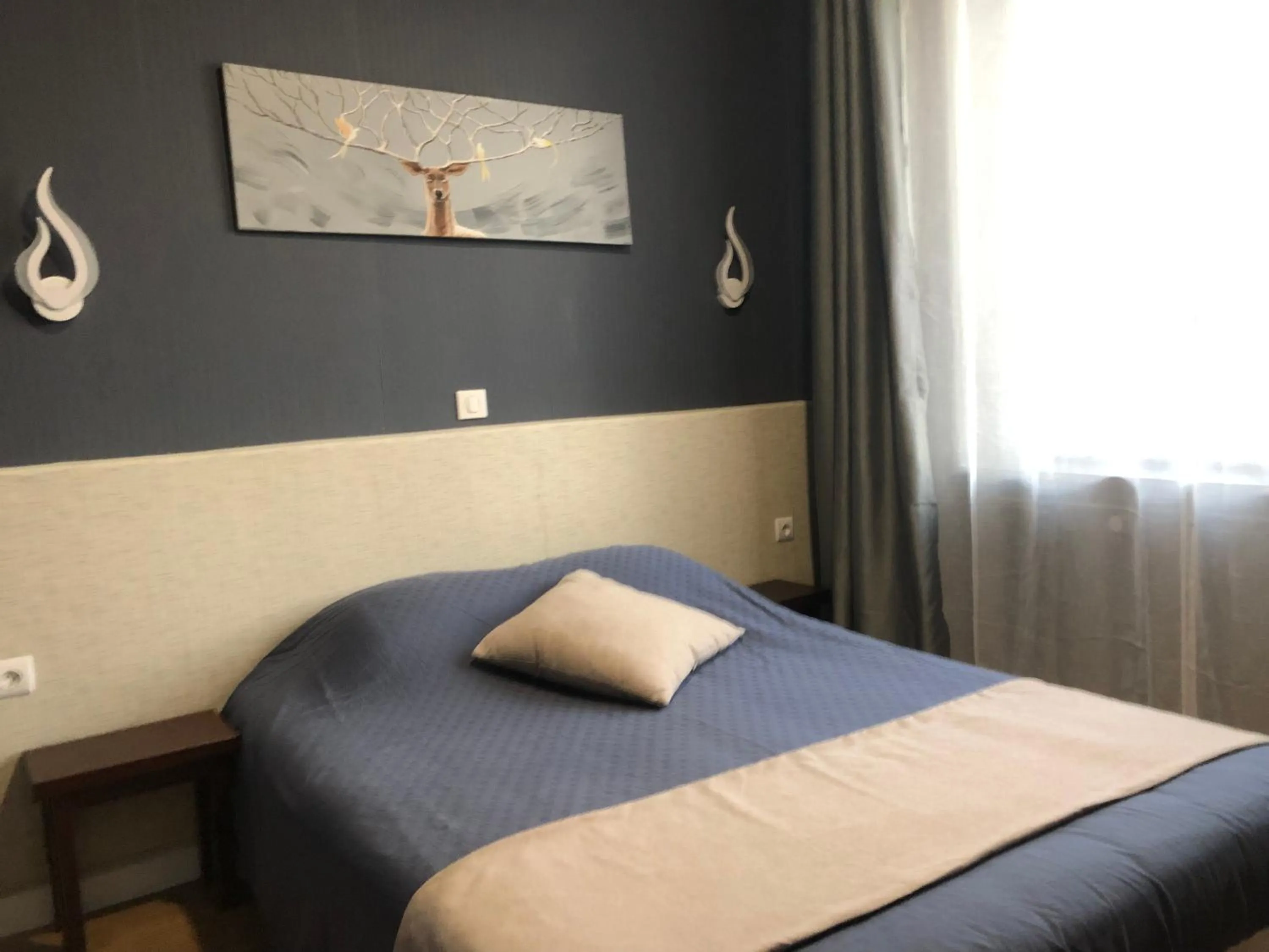 Bed in L'EMBLEME - BOUTIQUE HOTEL