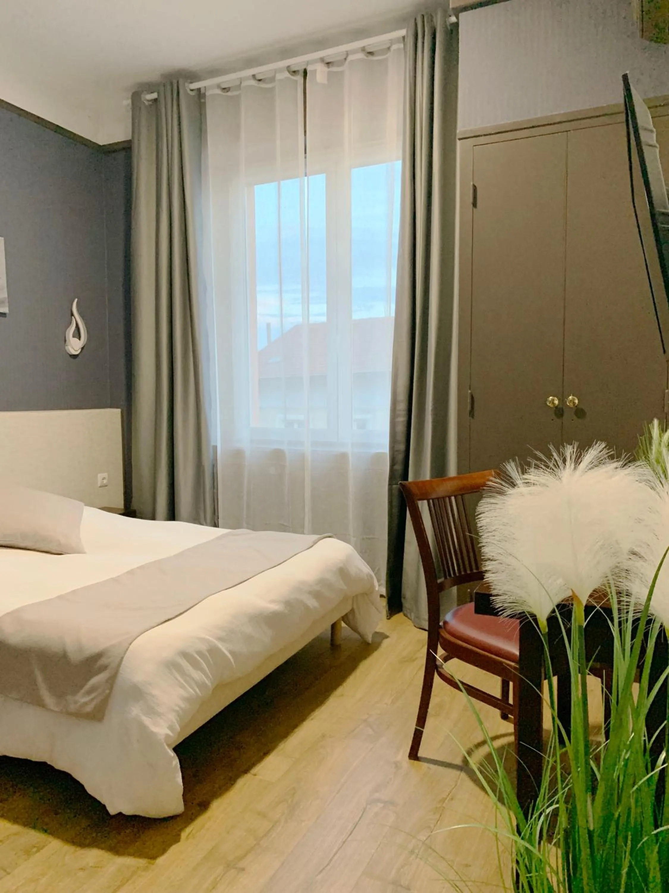 Bed in L'EMBLEME - BOUTIQUE HOTEL