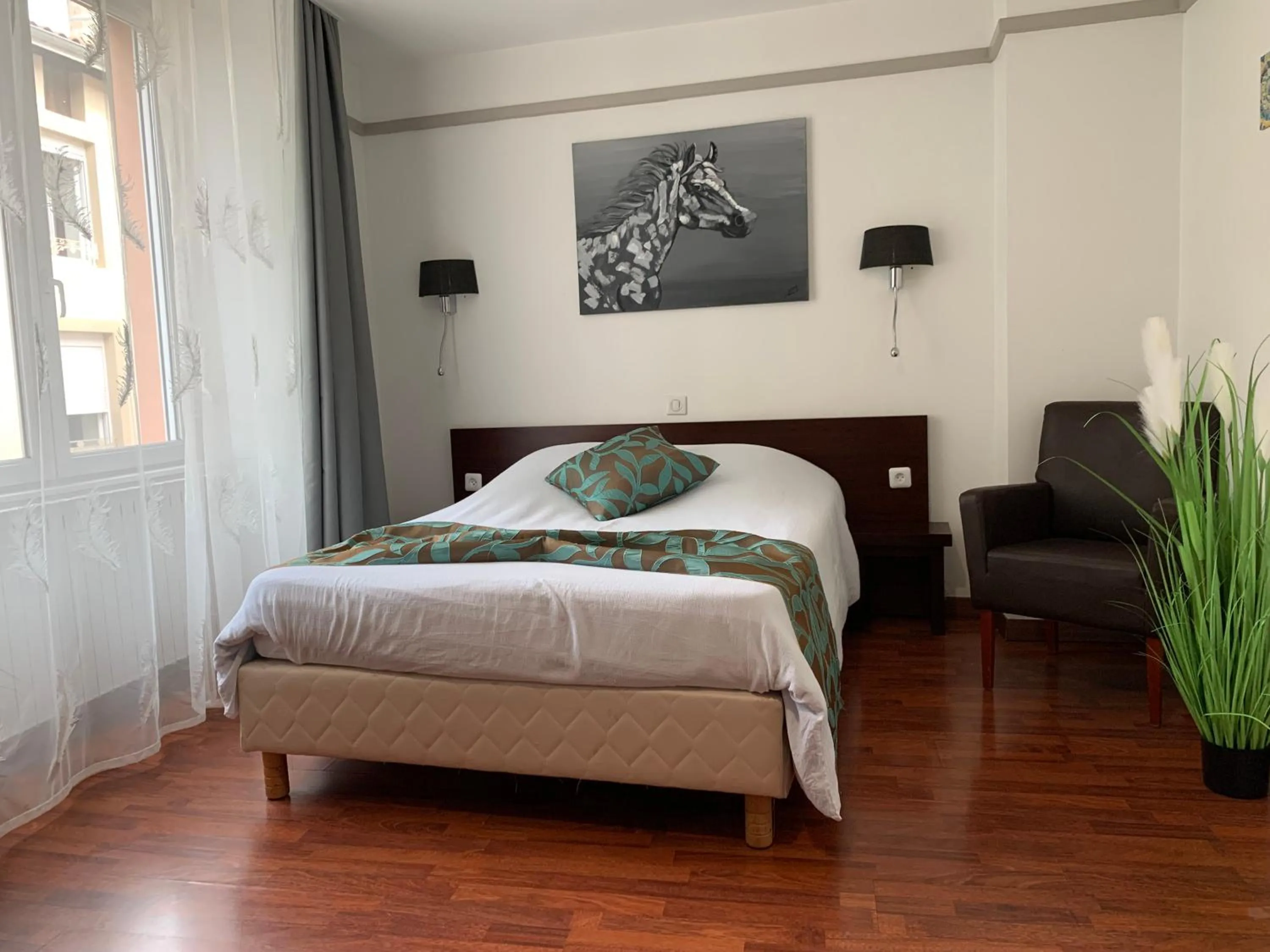 Bed in L'EMBLEME - BOUTIQUE HOTEL