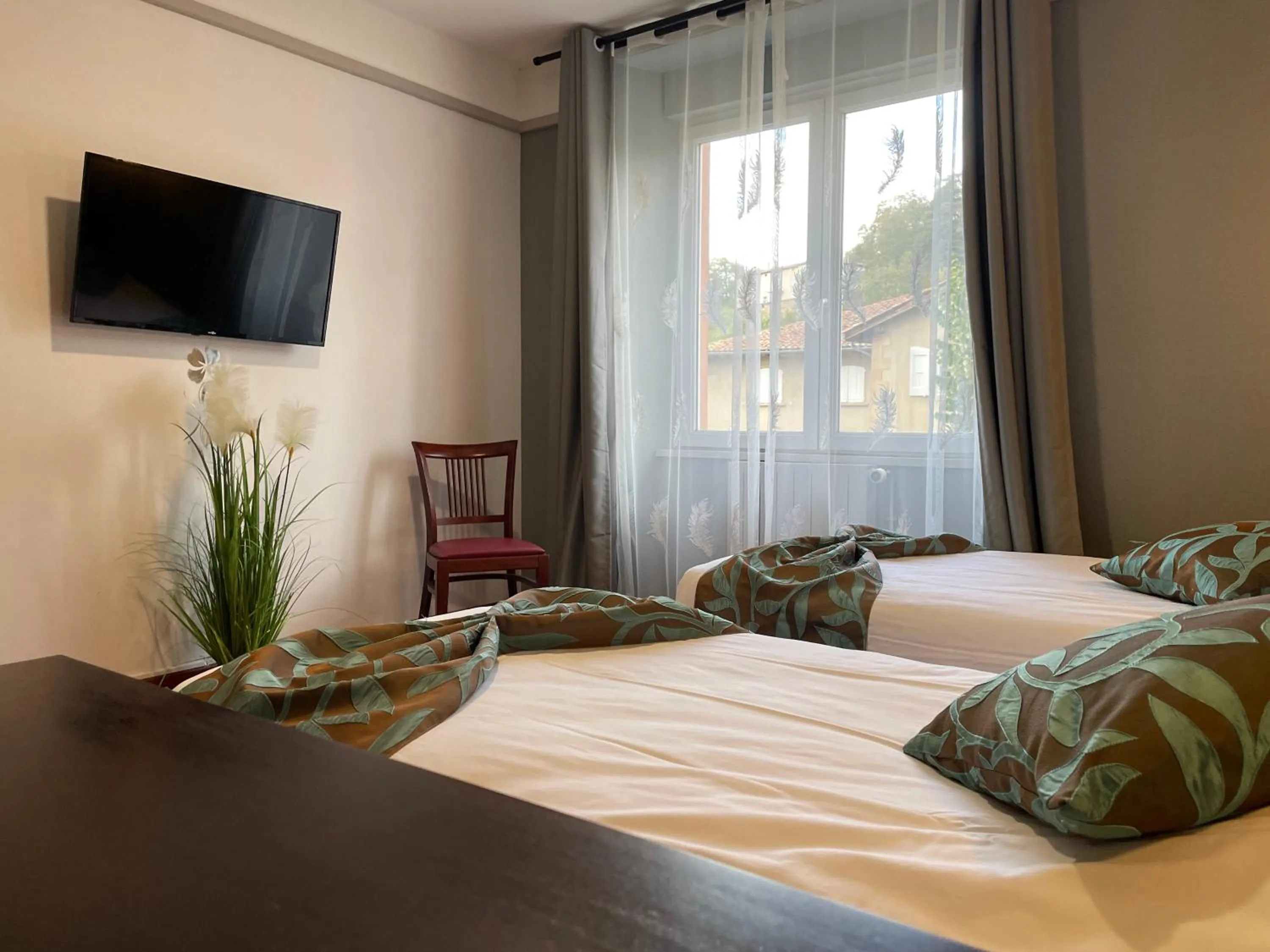 Bed in L'EMBLEME - BOUTIQUE HOTEL