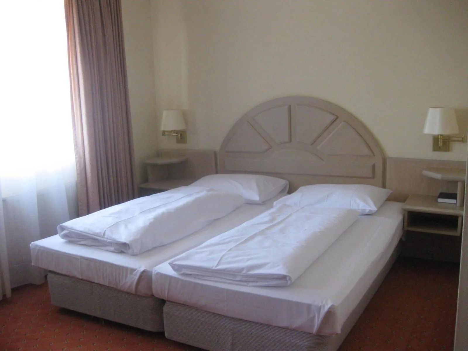 Bed in Abakus-Hotel