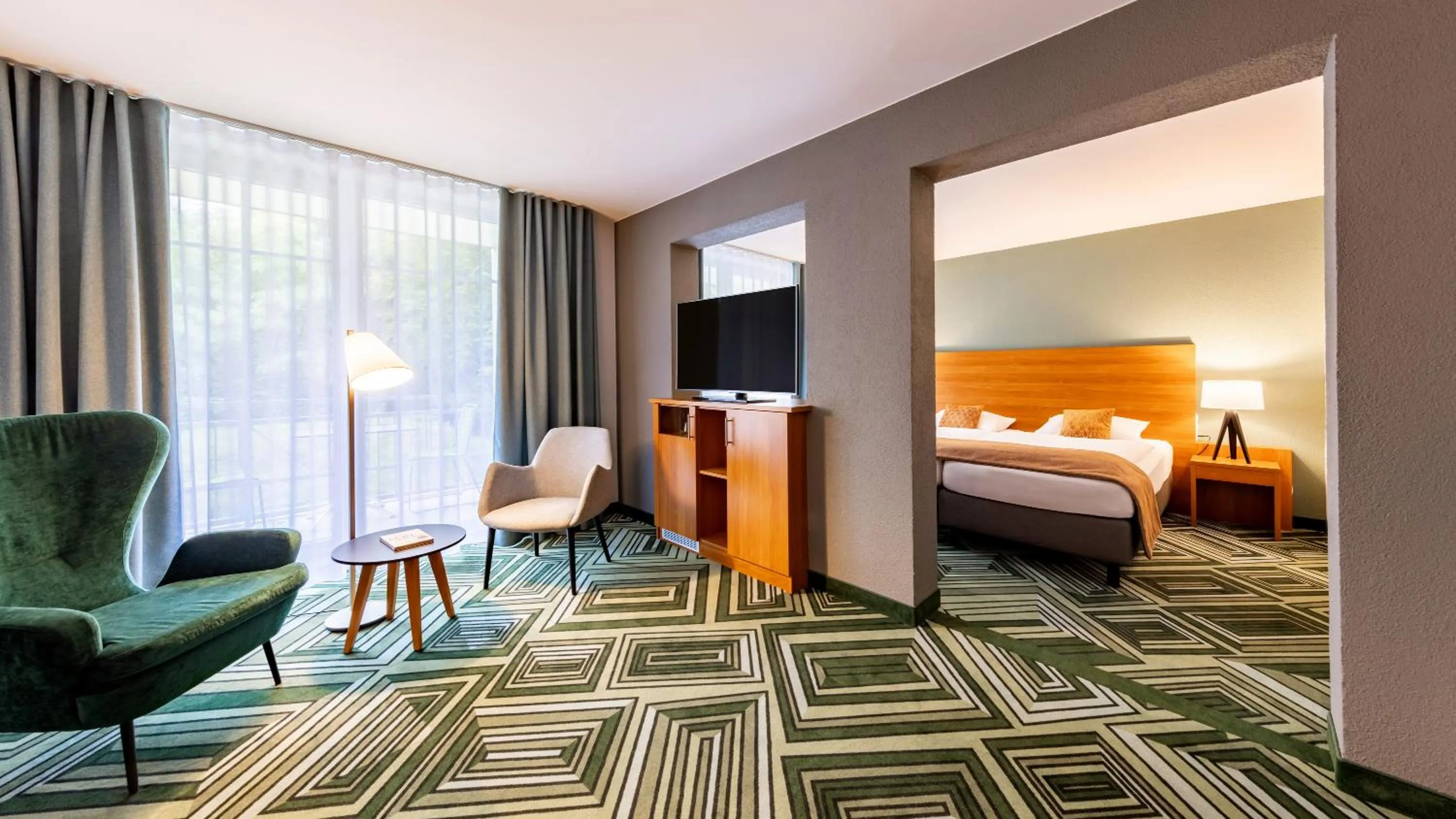 Living room, Bed in Parkhotel Maximilian Ottobeuren