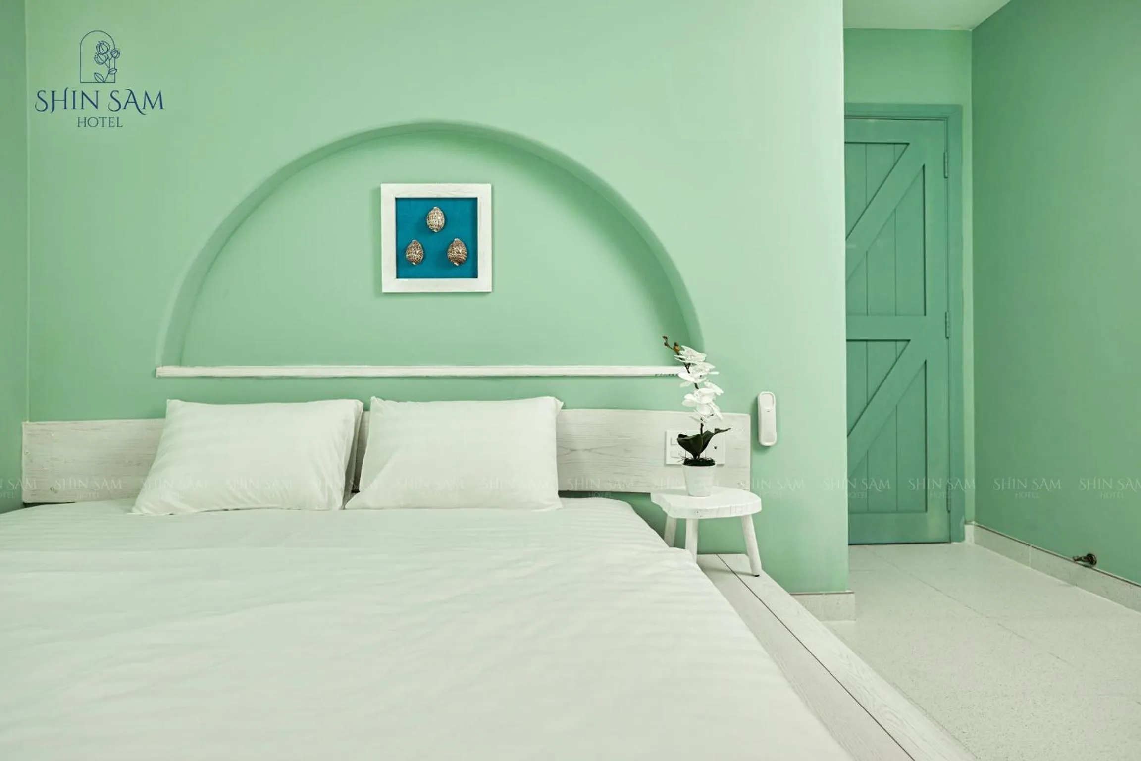 Bed in Shin Sam Boutique Hotel