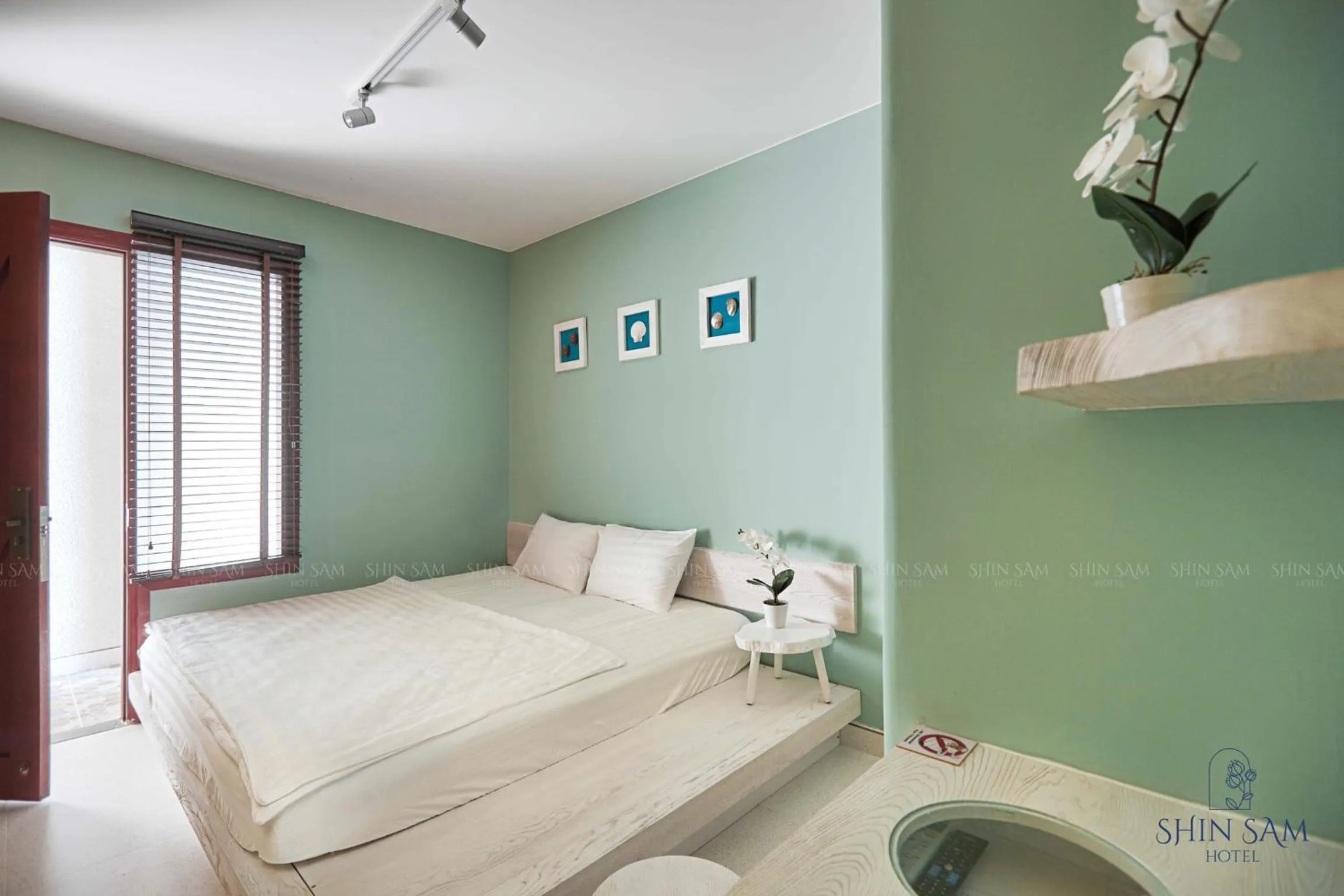 Bed in Shin Sam Boutique Hotel