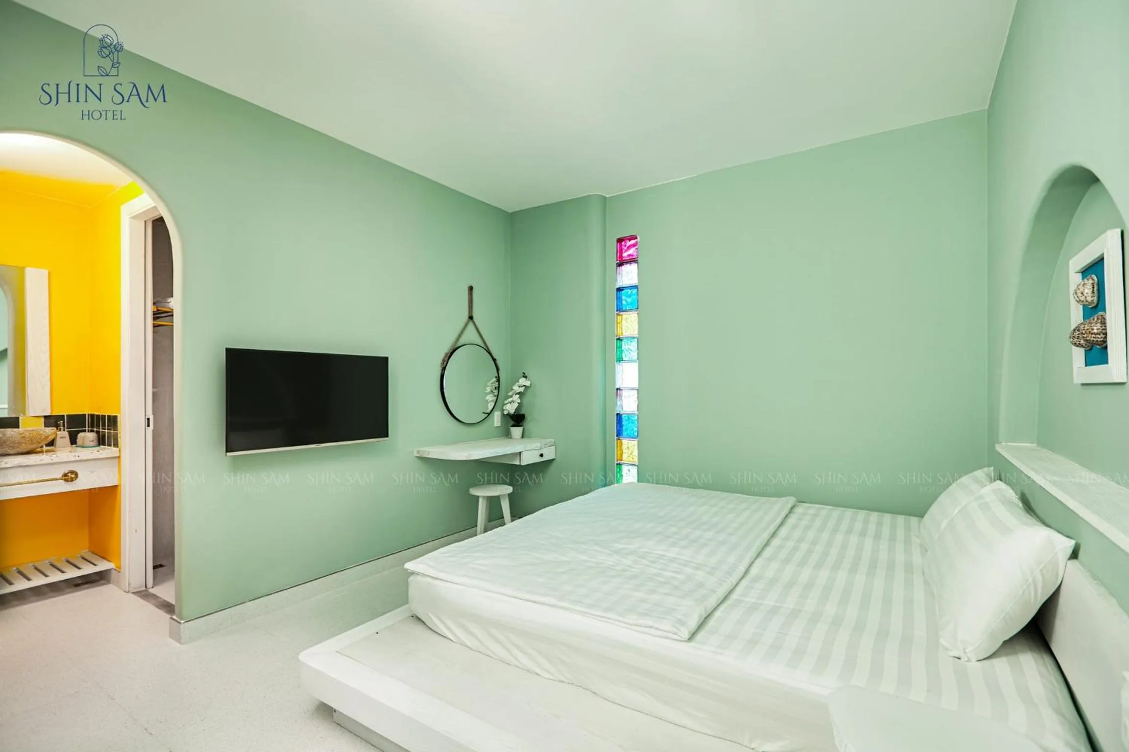 Bed in Shin Sam Boutique Hotel