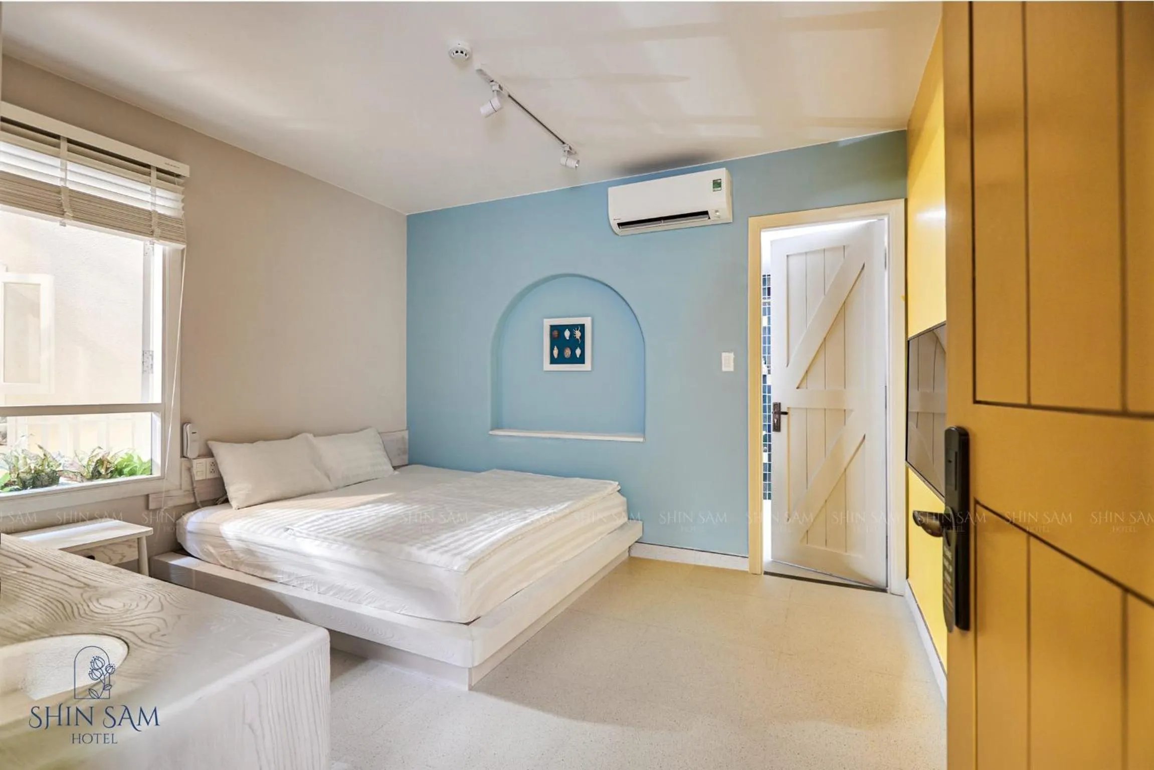 Bed in Shin Sam Boutique Hotel