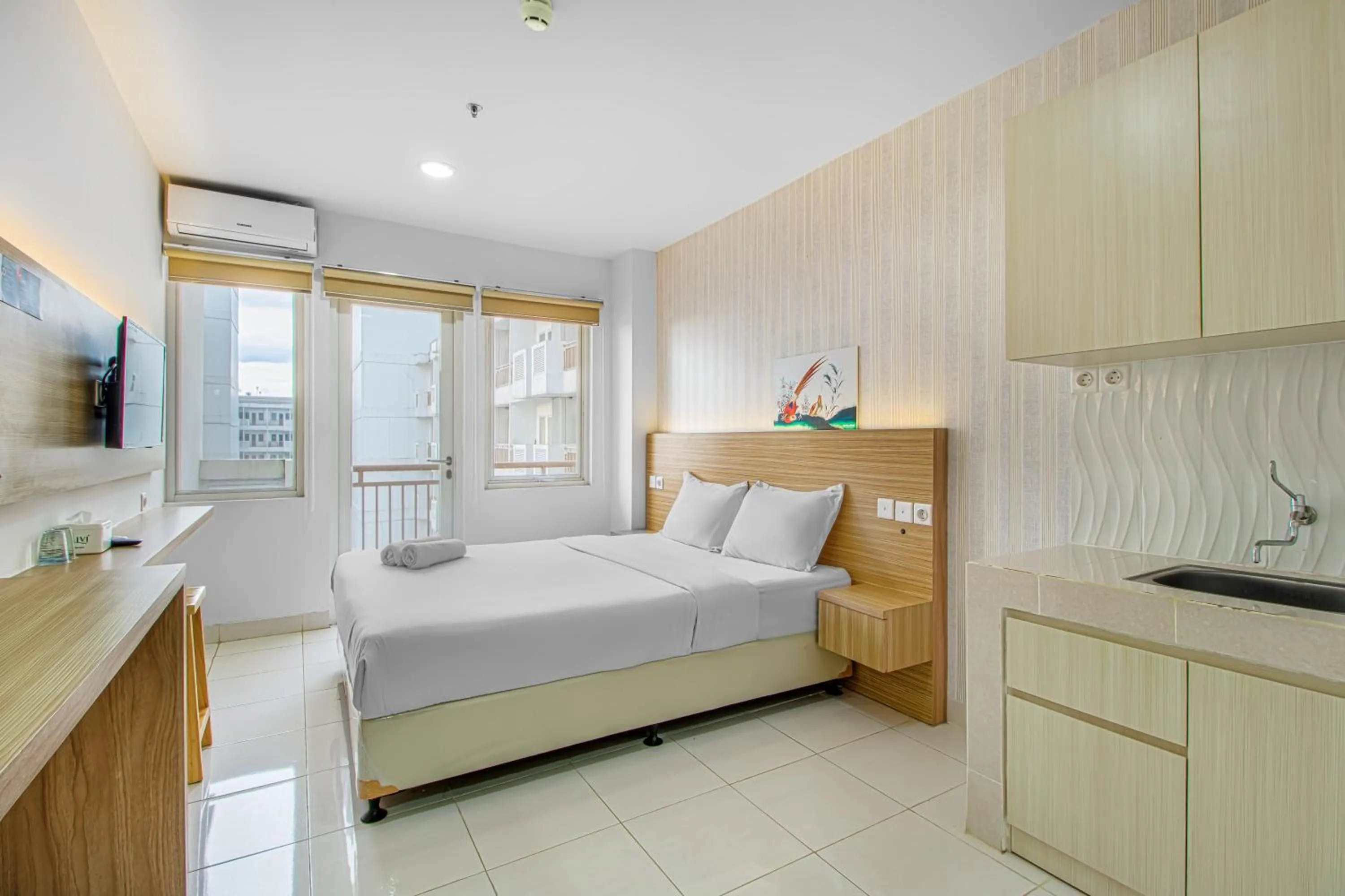 Photo of the whole room, Bed in Skyland Sentul Tower Apartment