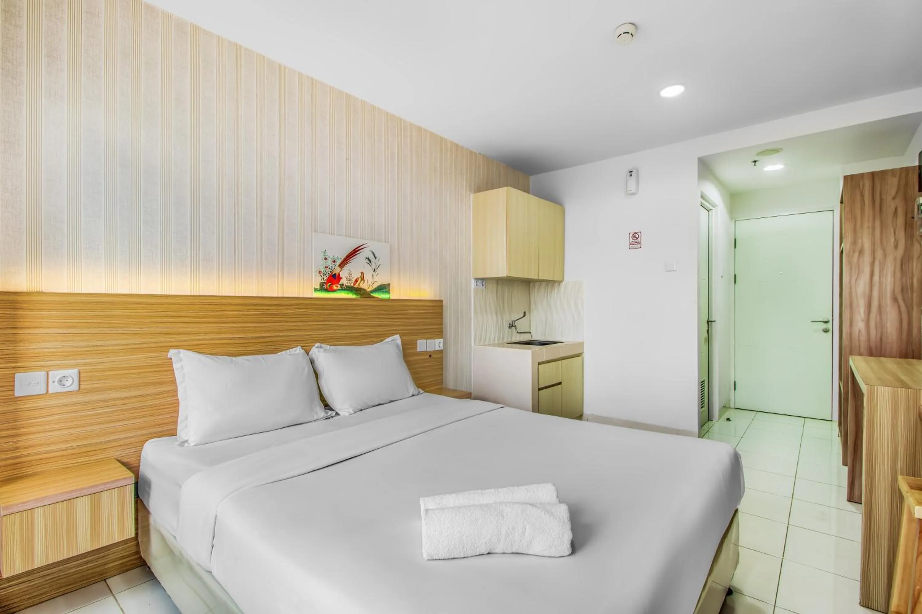 Bed in Skyland Sentul Tower Apartment