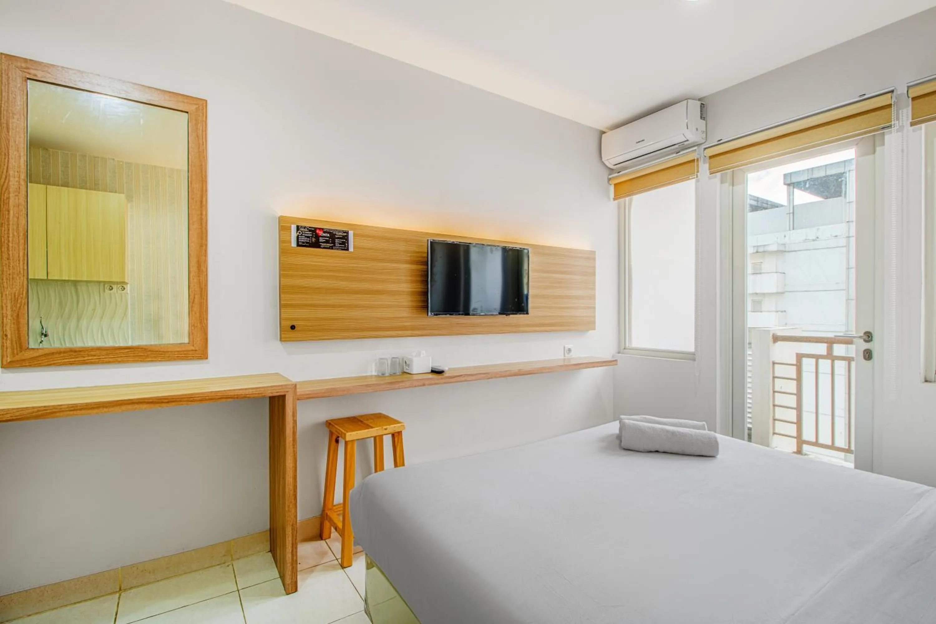 Bed in Skyland Sentul Tower Apartment