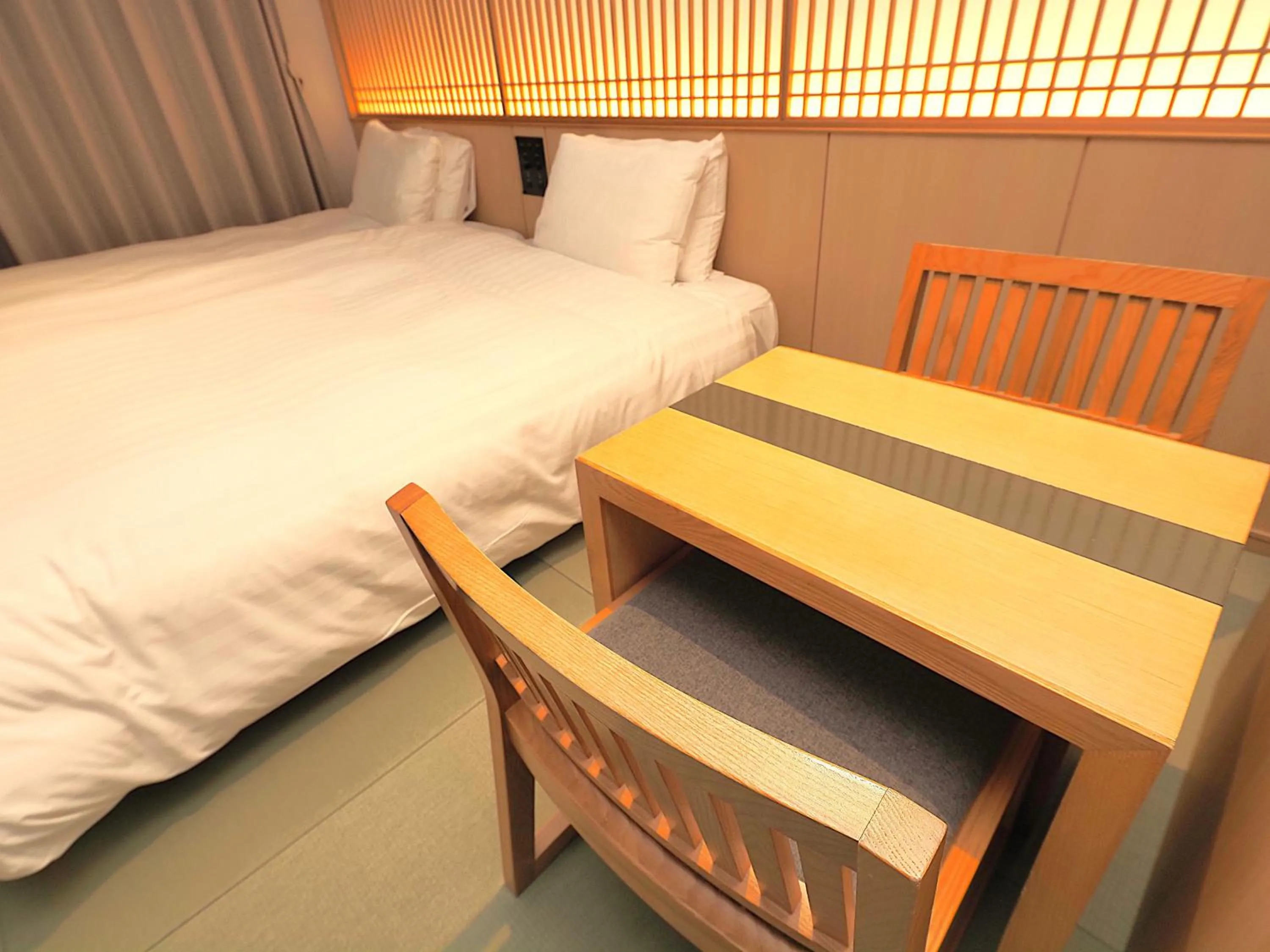 Bed in Henn na Hotel Premier Kyoto Gojo Karasuma -Formerly Watermark Hotel Kyoto-