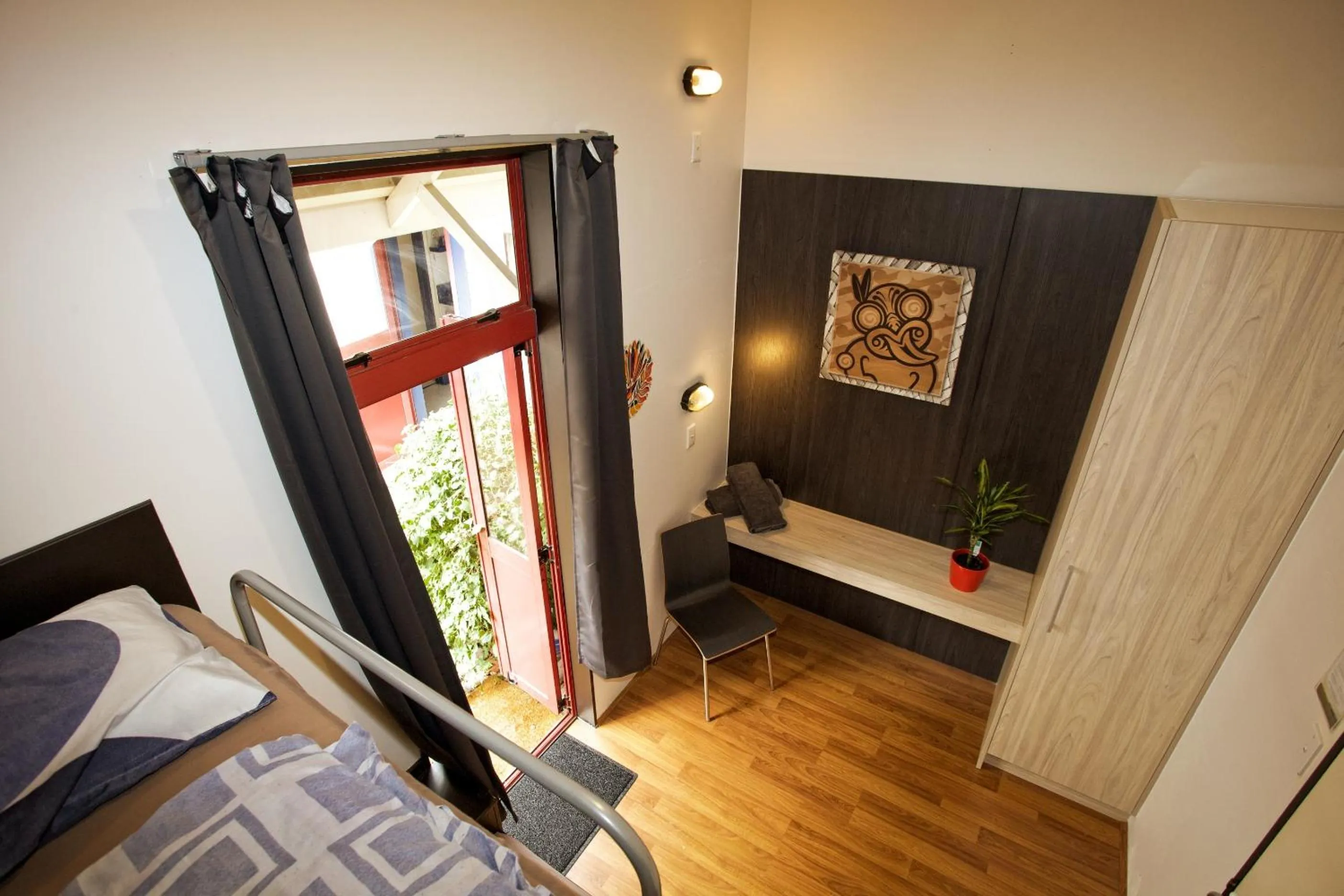 bunk bed, TV/Entertainment Center in Stables Lodge Backpackers