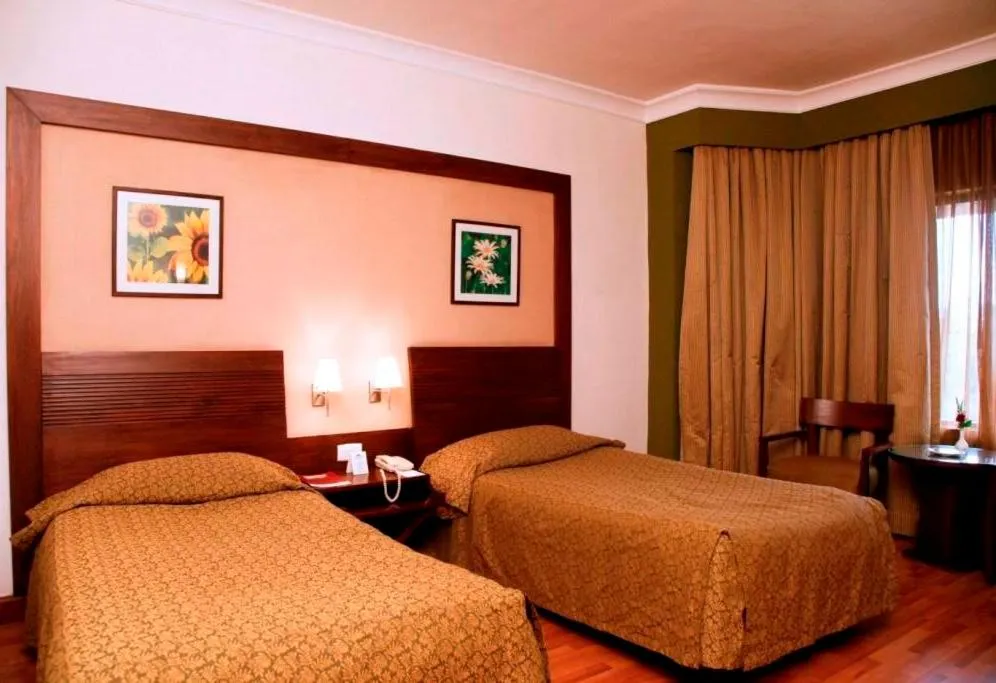 Photo of the whole room, Bed in The Retreat Hotel & Convention Centre