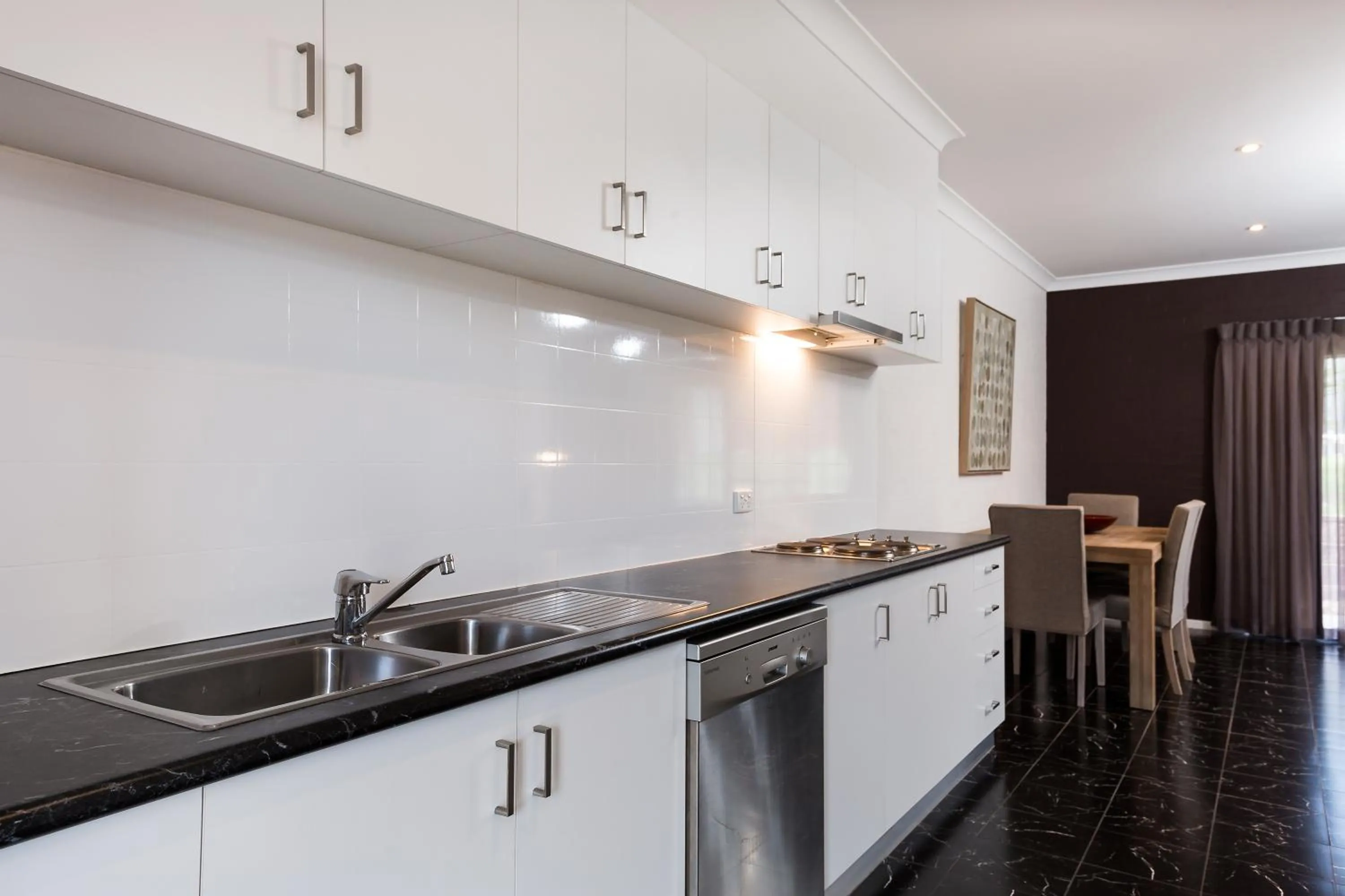 Kitchen or kitchenette in Blazing Stump Motel & Suites