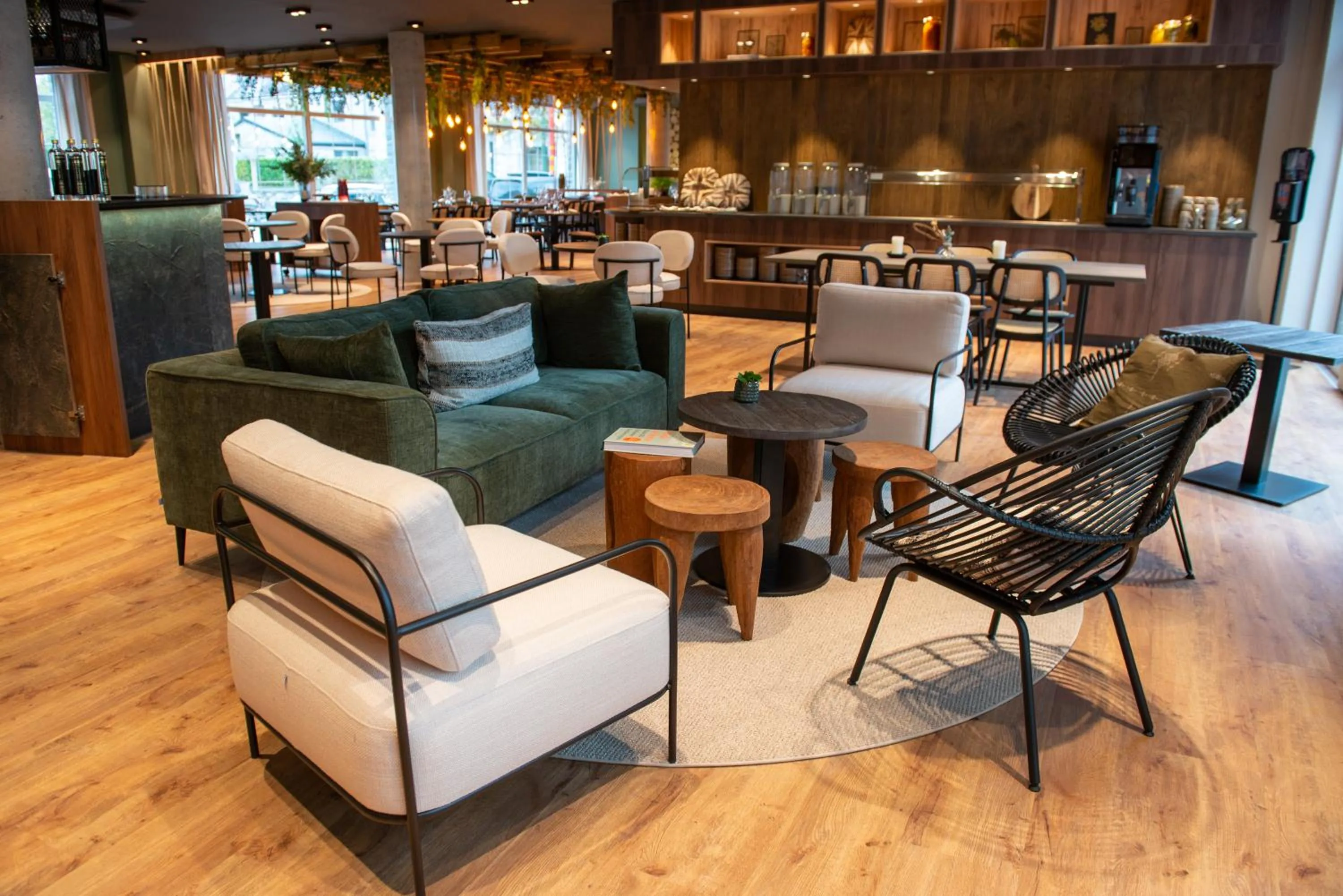 Communal lounge/ TV room in Mercure Han-sur-Lesse