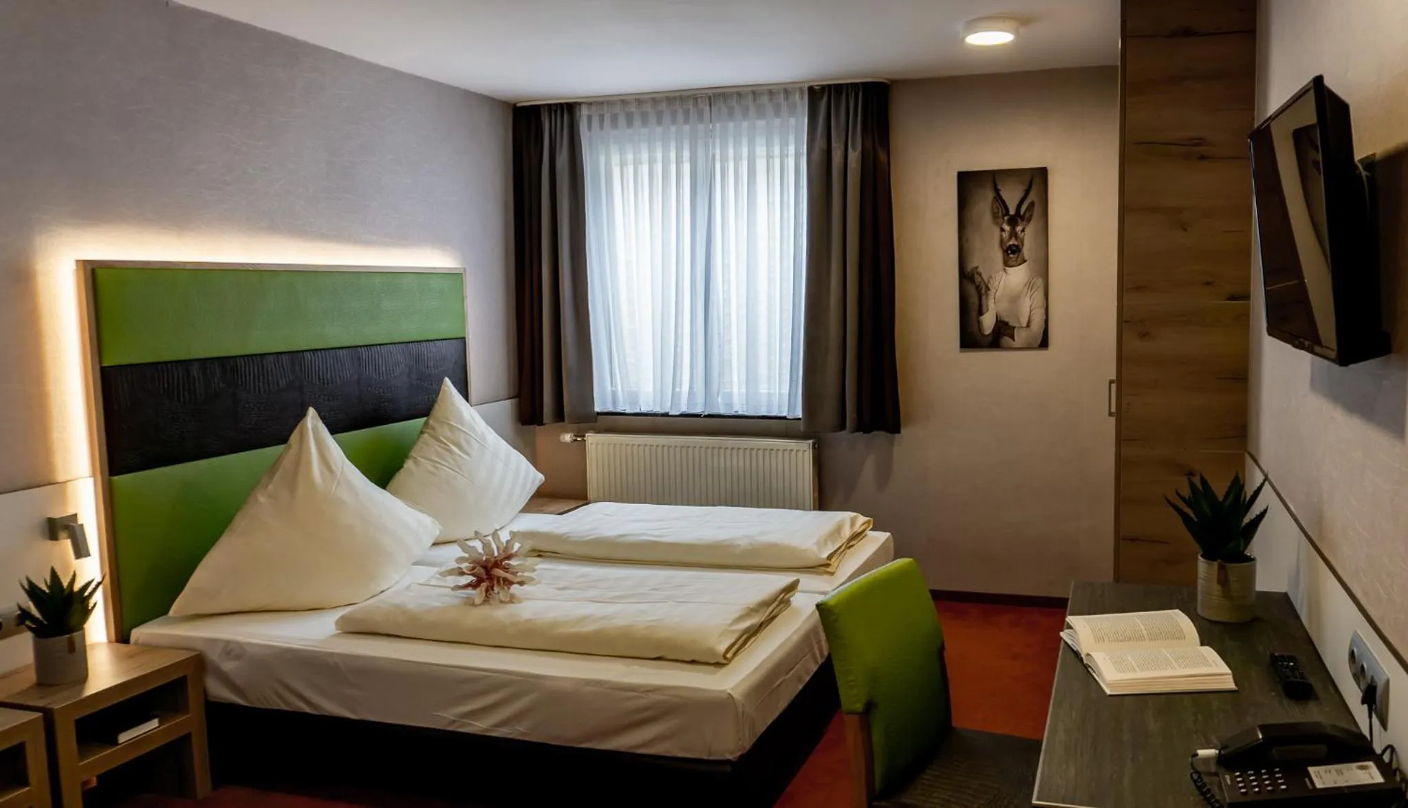 Photo of the whole room, Bed in Hotel Sonne - Das kleine Altstadt Hotel