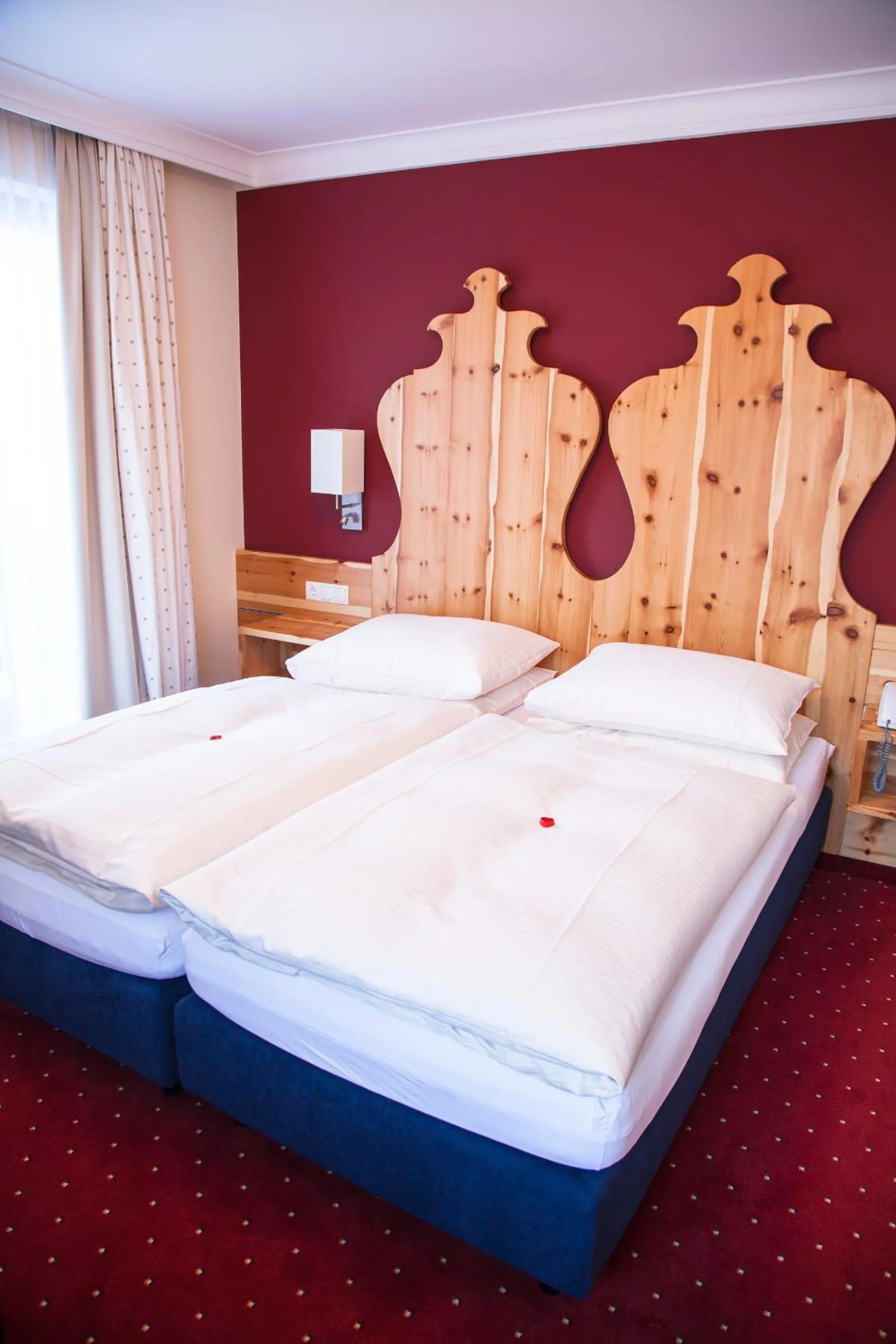 Bed in Hotel Enzian by Alpeffect Hotels