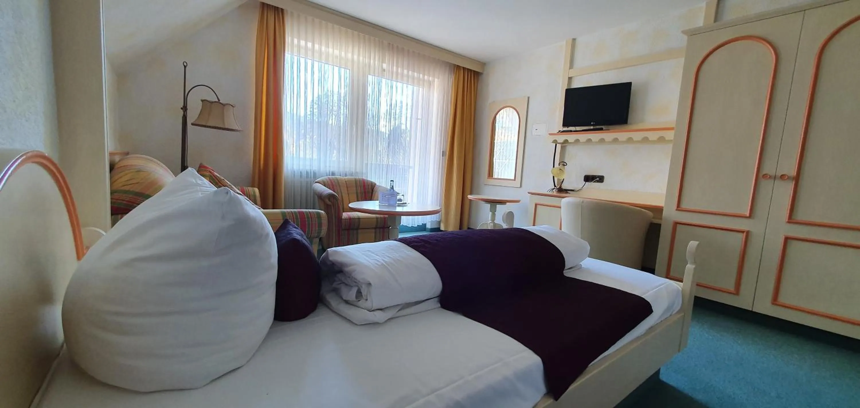 Bedroom in Hotel Kainsbacher Mühle