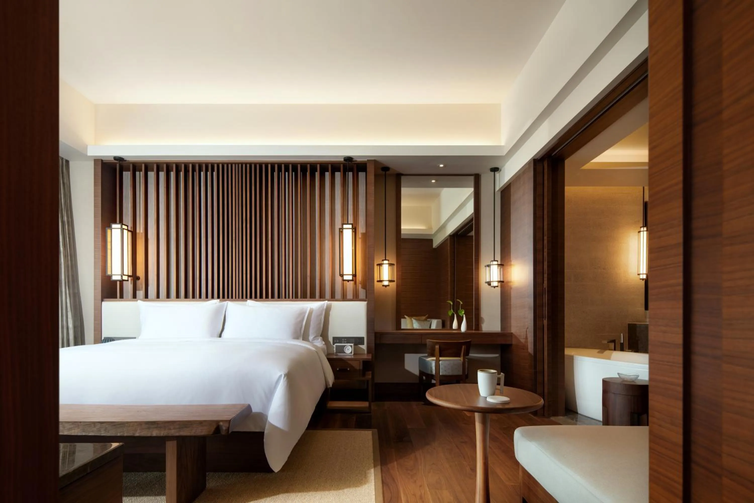 Bed in New World Qingyuan Hotel -formerly KHOS QINGYUAN