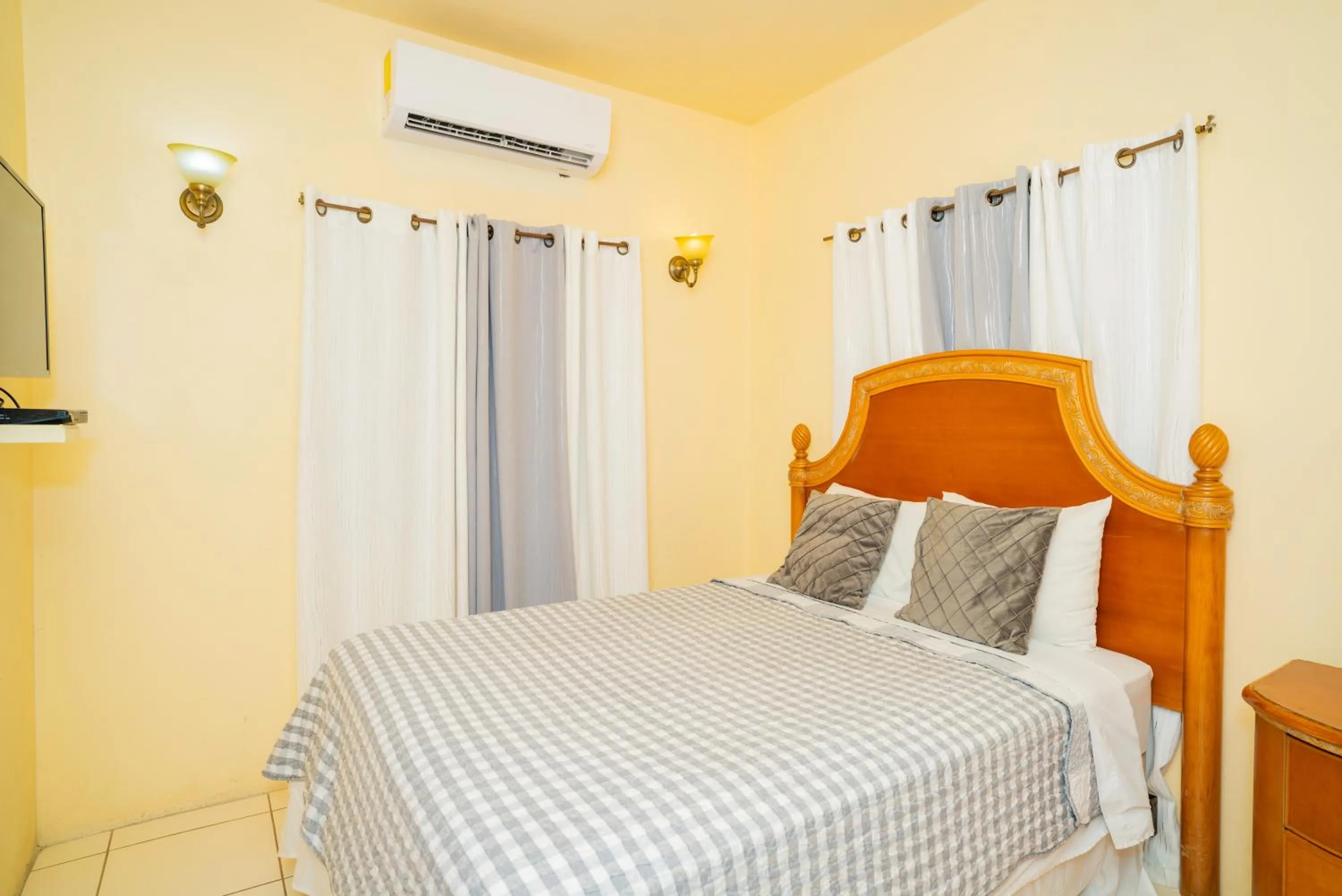 Bed in Connie's Comfort Suites