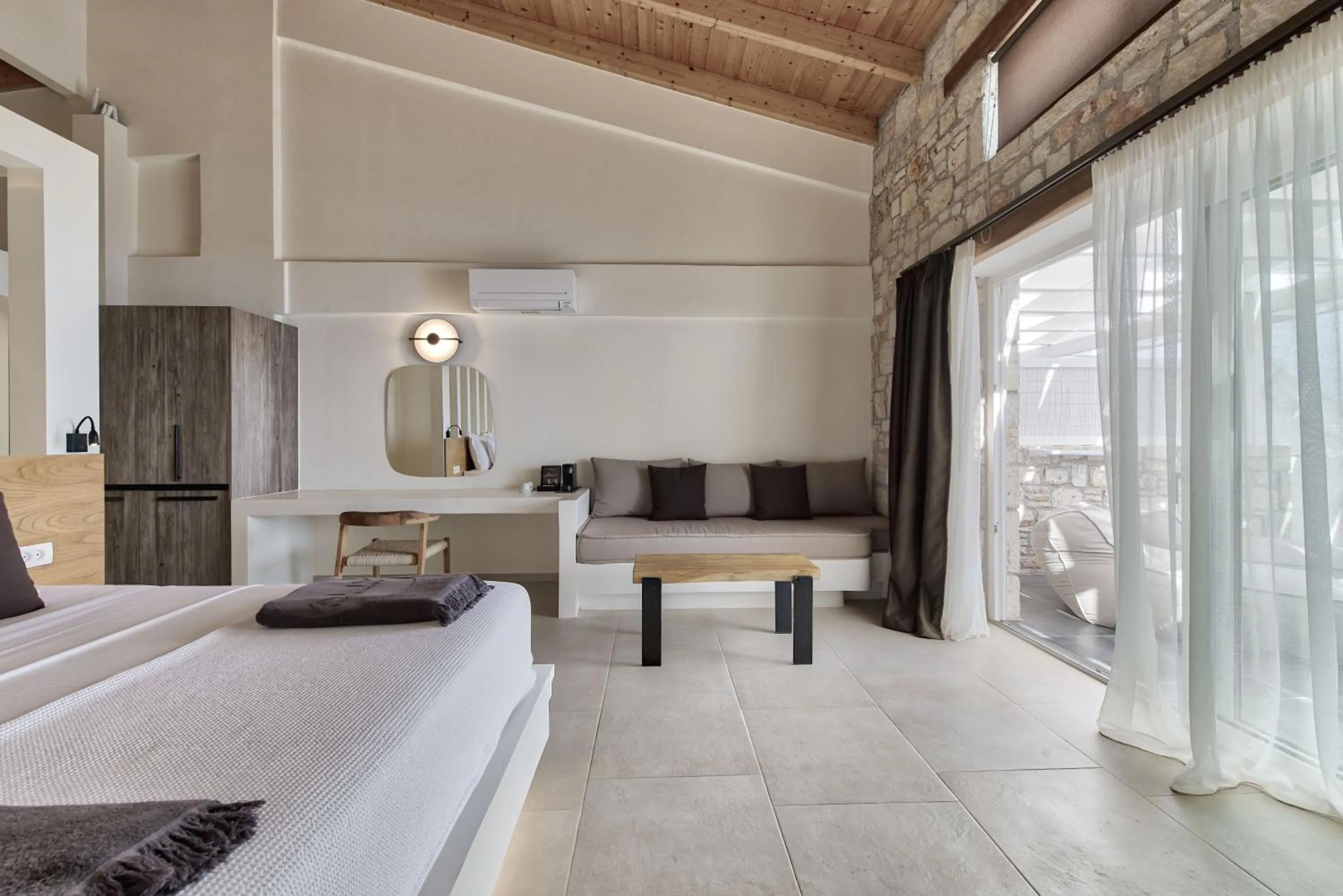 Bed in Aliv stone suites & spa