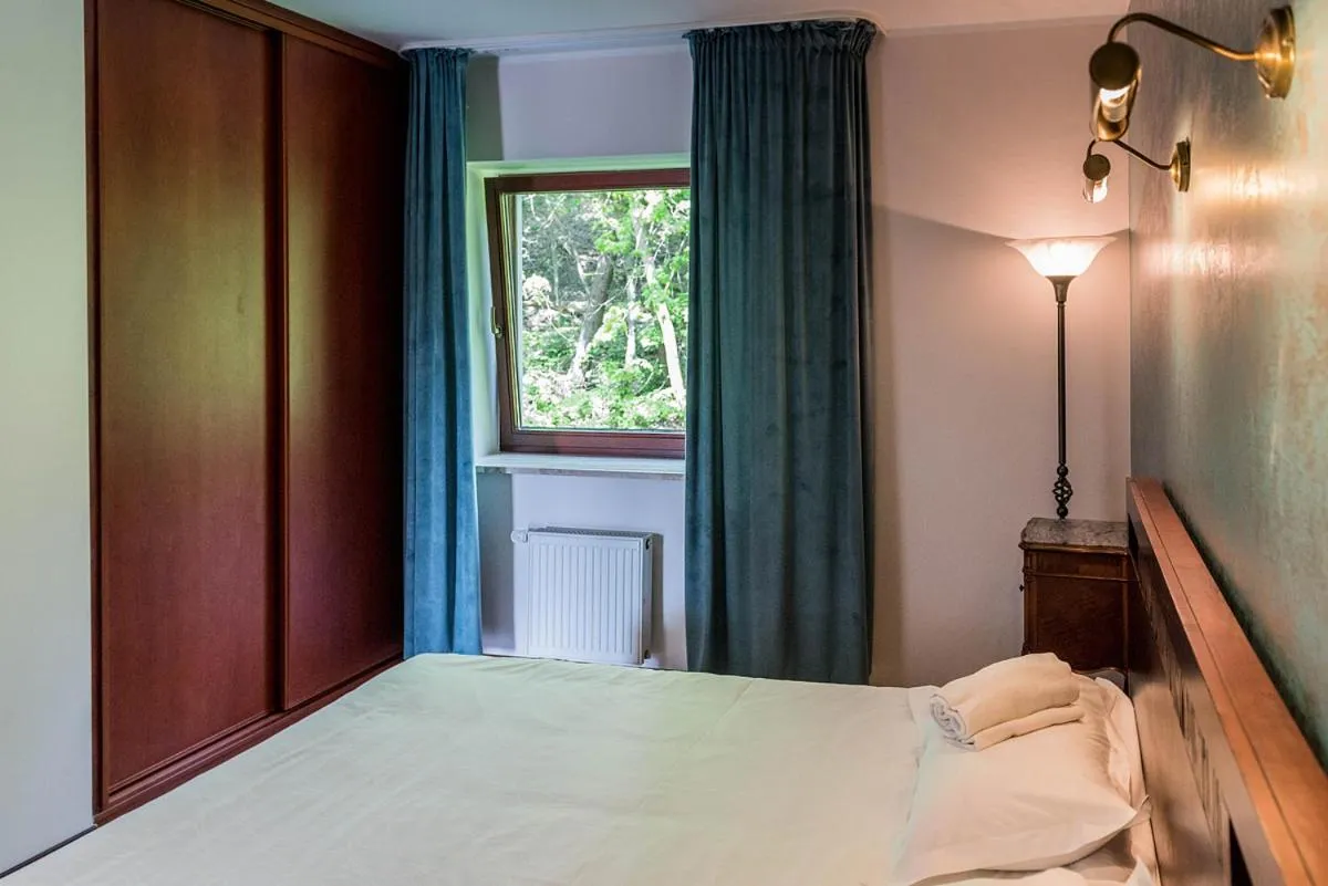 Bed in 4 Pory Roku Resort Sauna & Spa