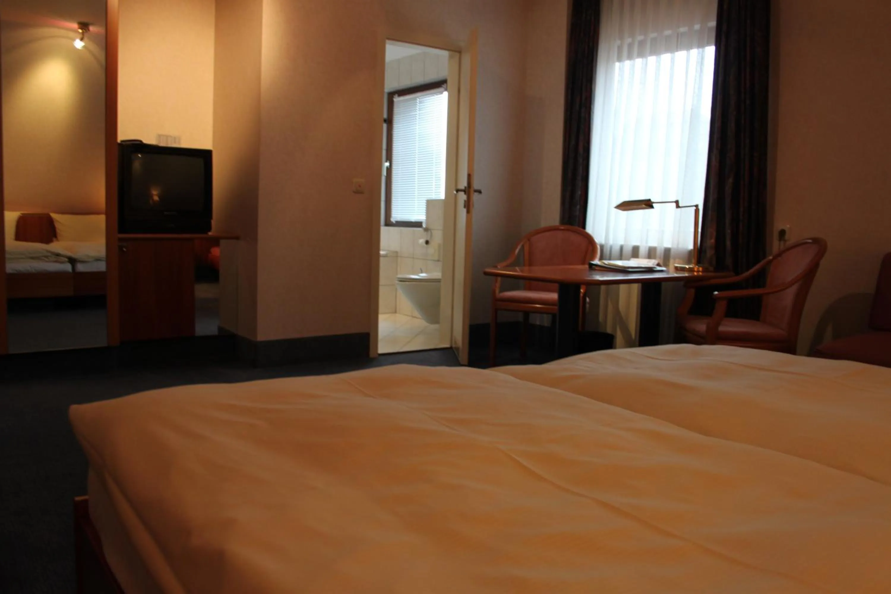 Photo of the whole room, Bed in Hotel-Gasthof Die Post Brennerei Frankenhöhe