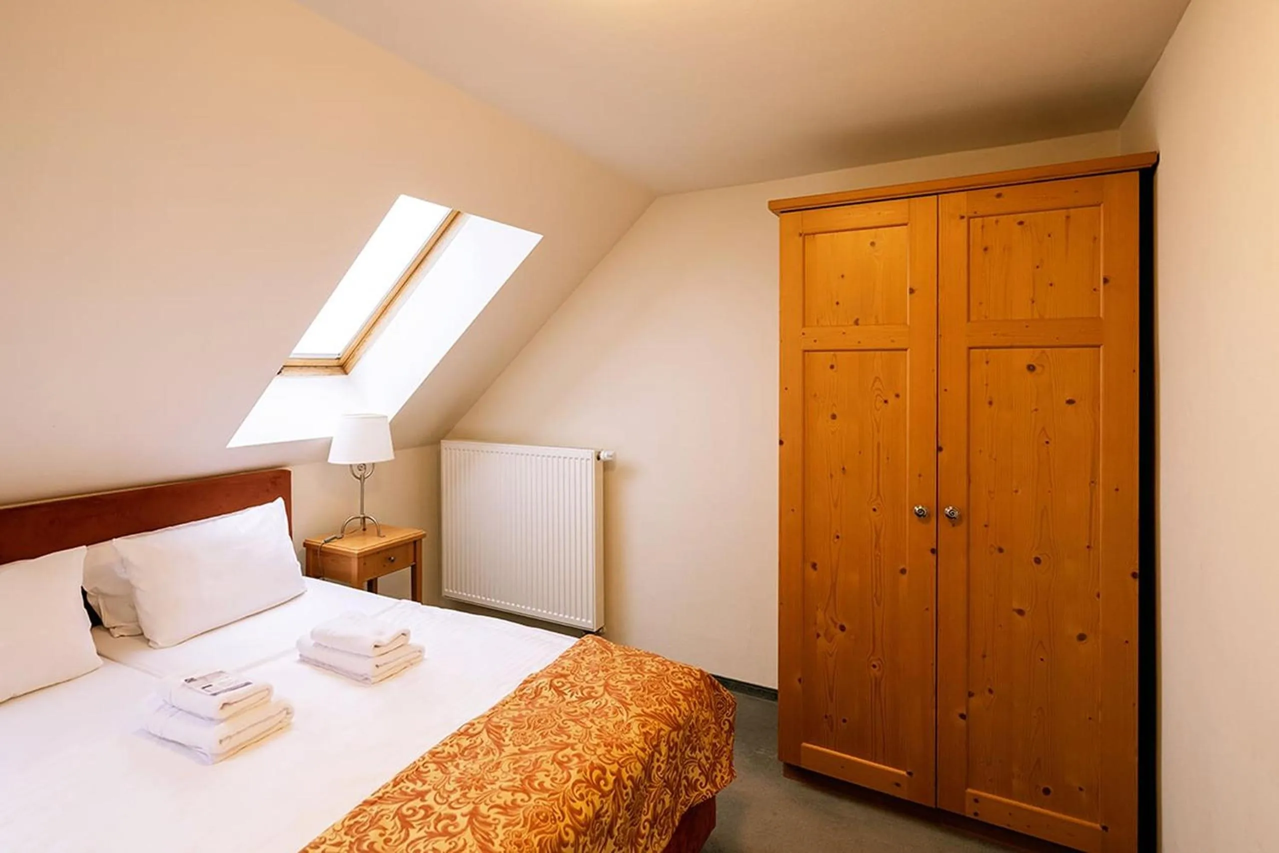 Bed in Apparthotel Bad Schandau by STEIGER Hotels