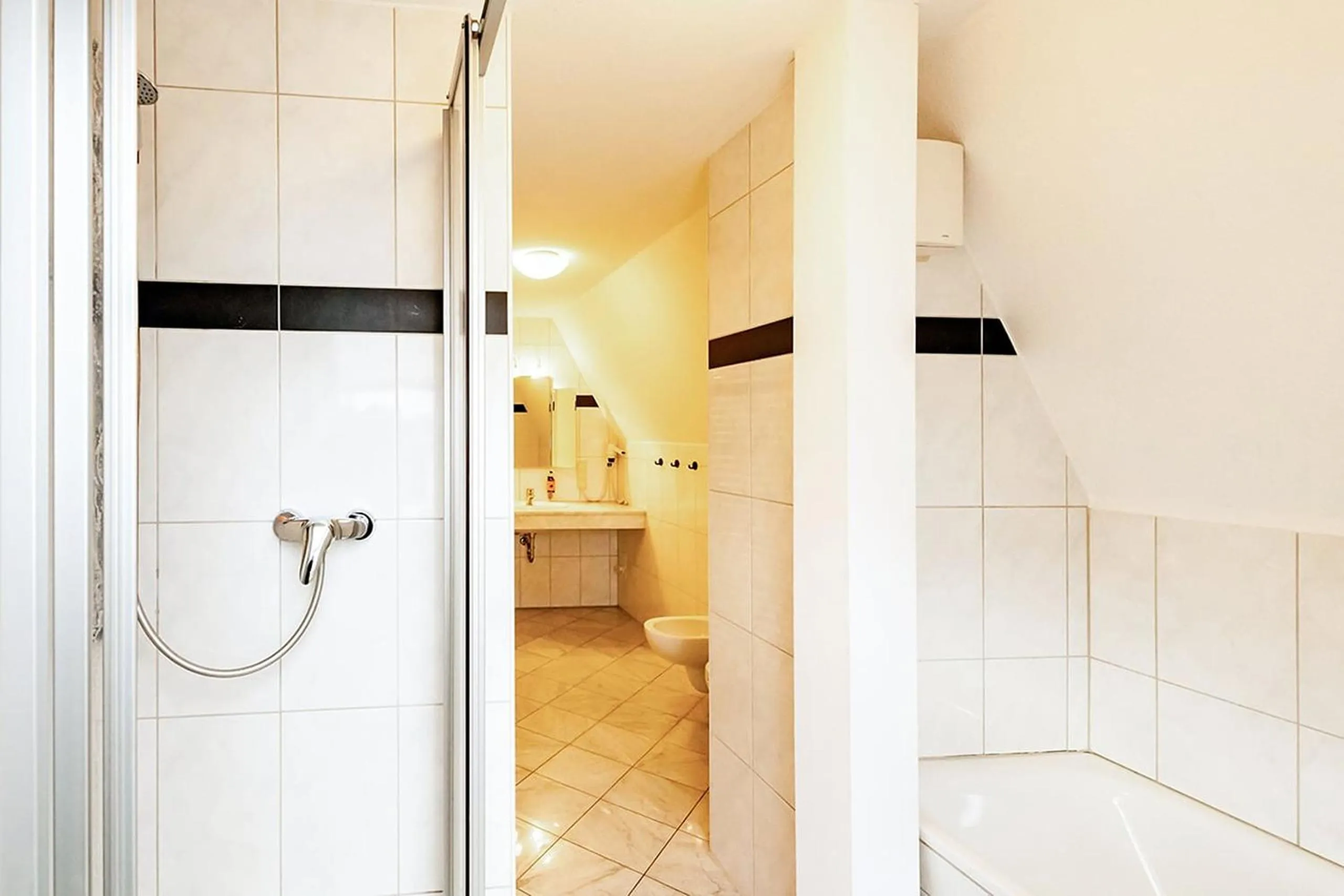 Bathroom in Apparthotel Bad Schandau by STEIGER Hotels