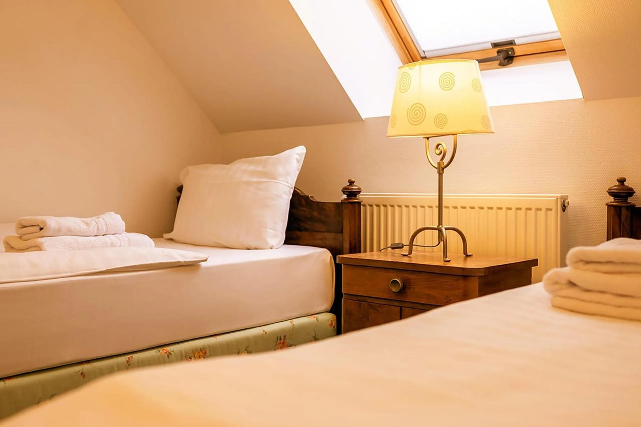 Bed in Apparthotel Bad Schandau by STEIGER Hotels