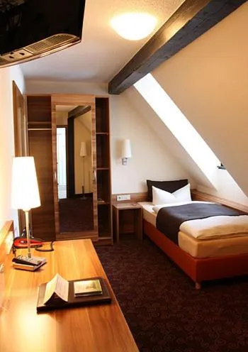Photo of the whole room, Bed in Hotel Goldener Hirsch