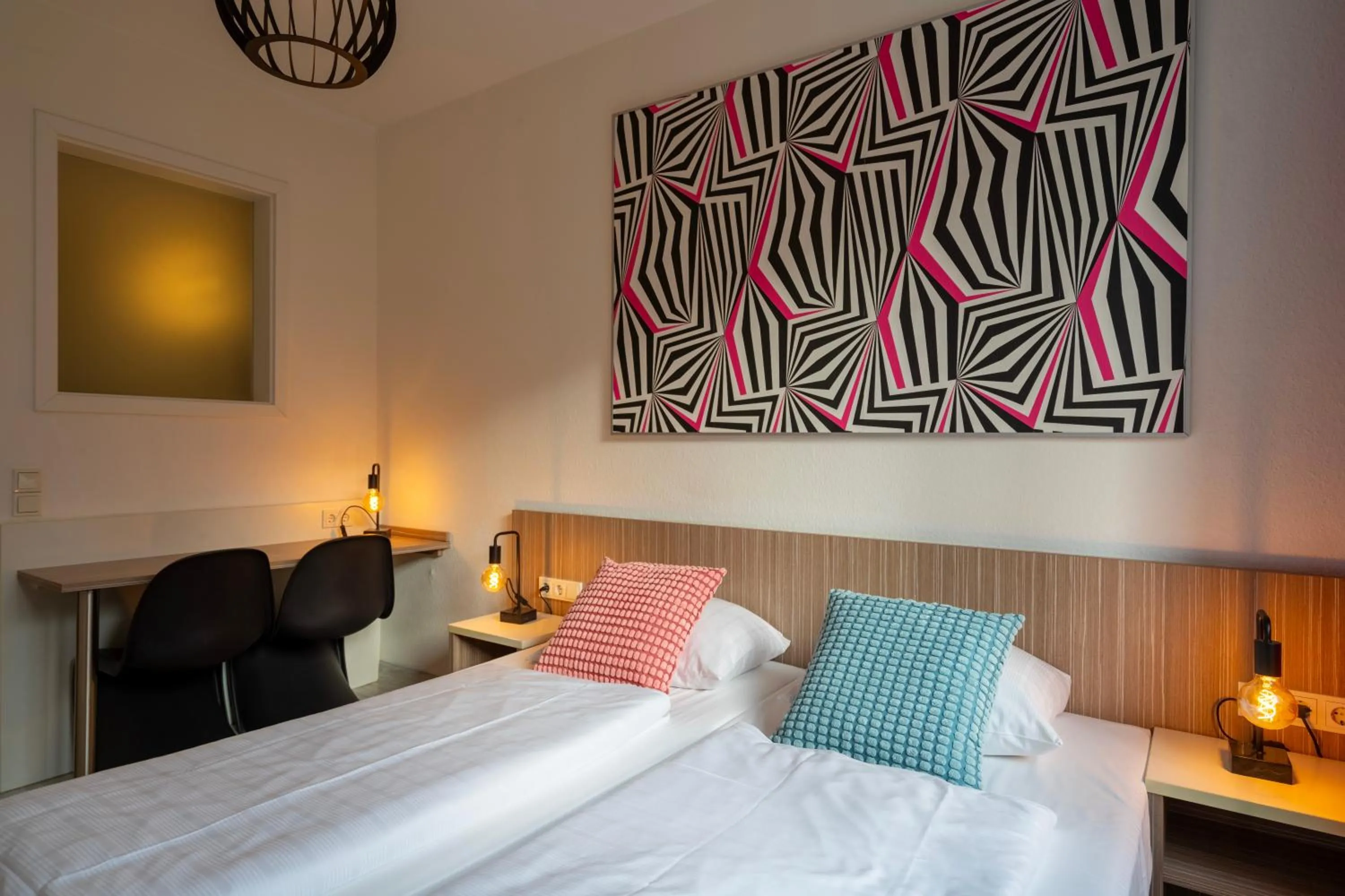 Bed in Hotel Madeleine Biohotel