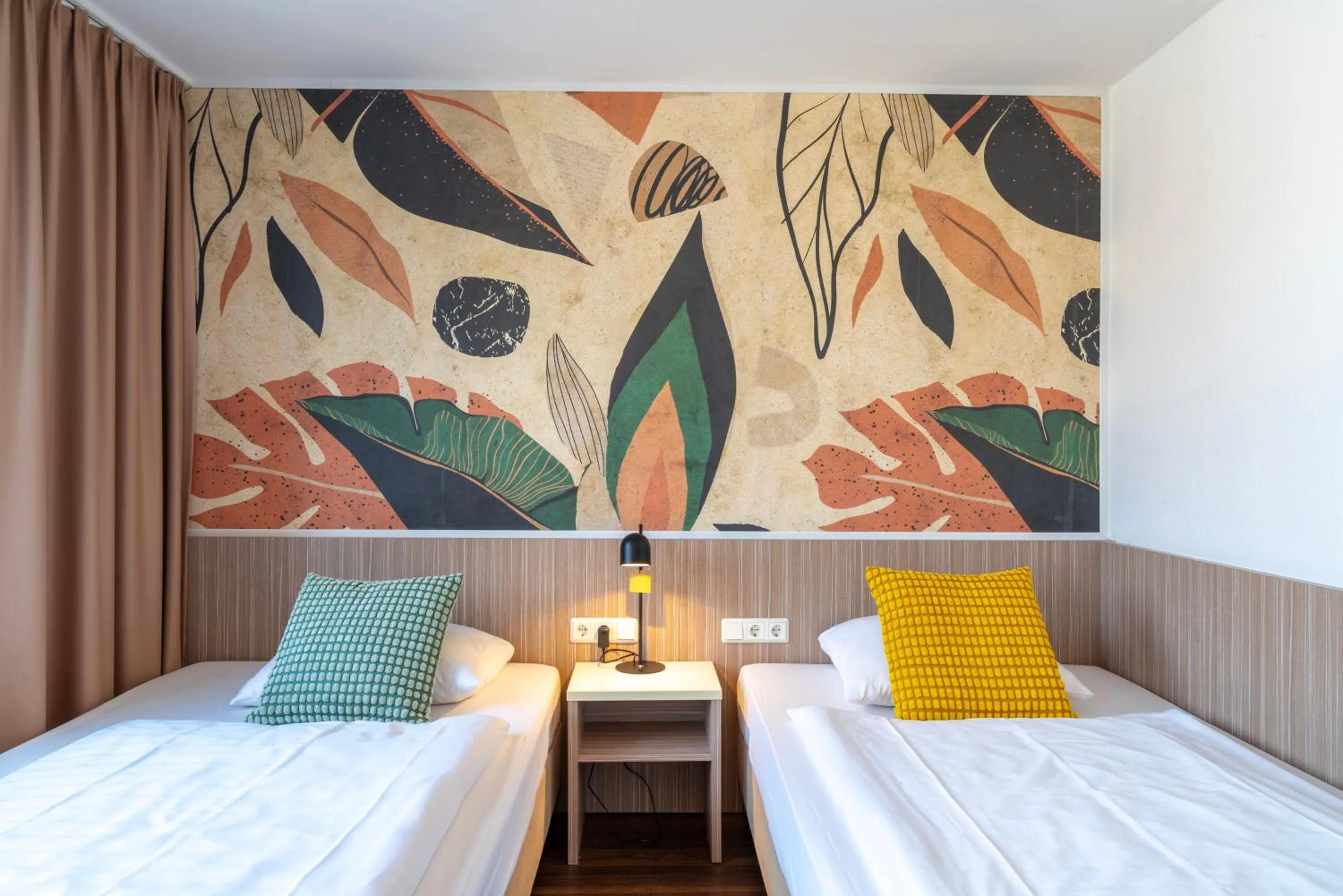 Bed in Hotel Madeleine Biohotel