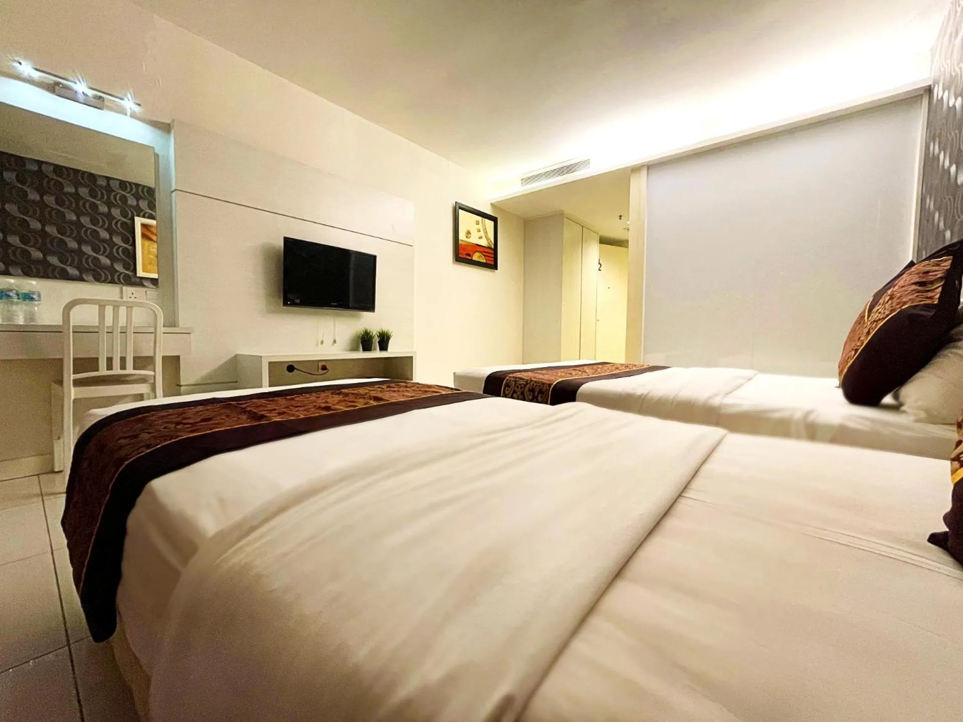 Bedroom in ESQ Shamelin Hotel