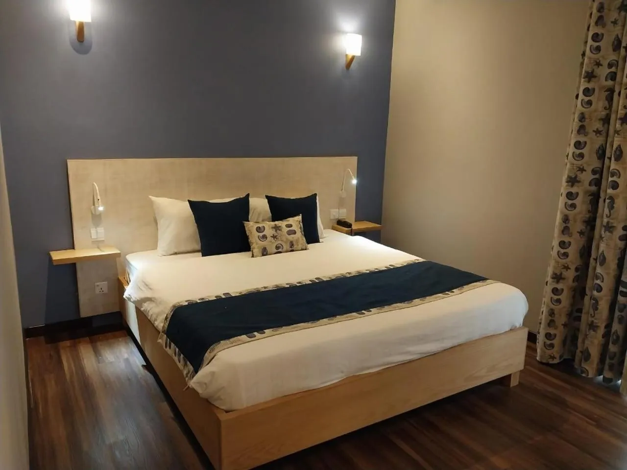 Bed in Le Grand Bleu Hotel