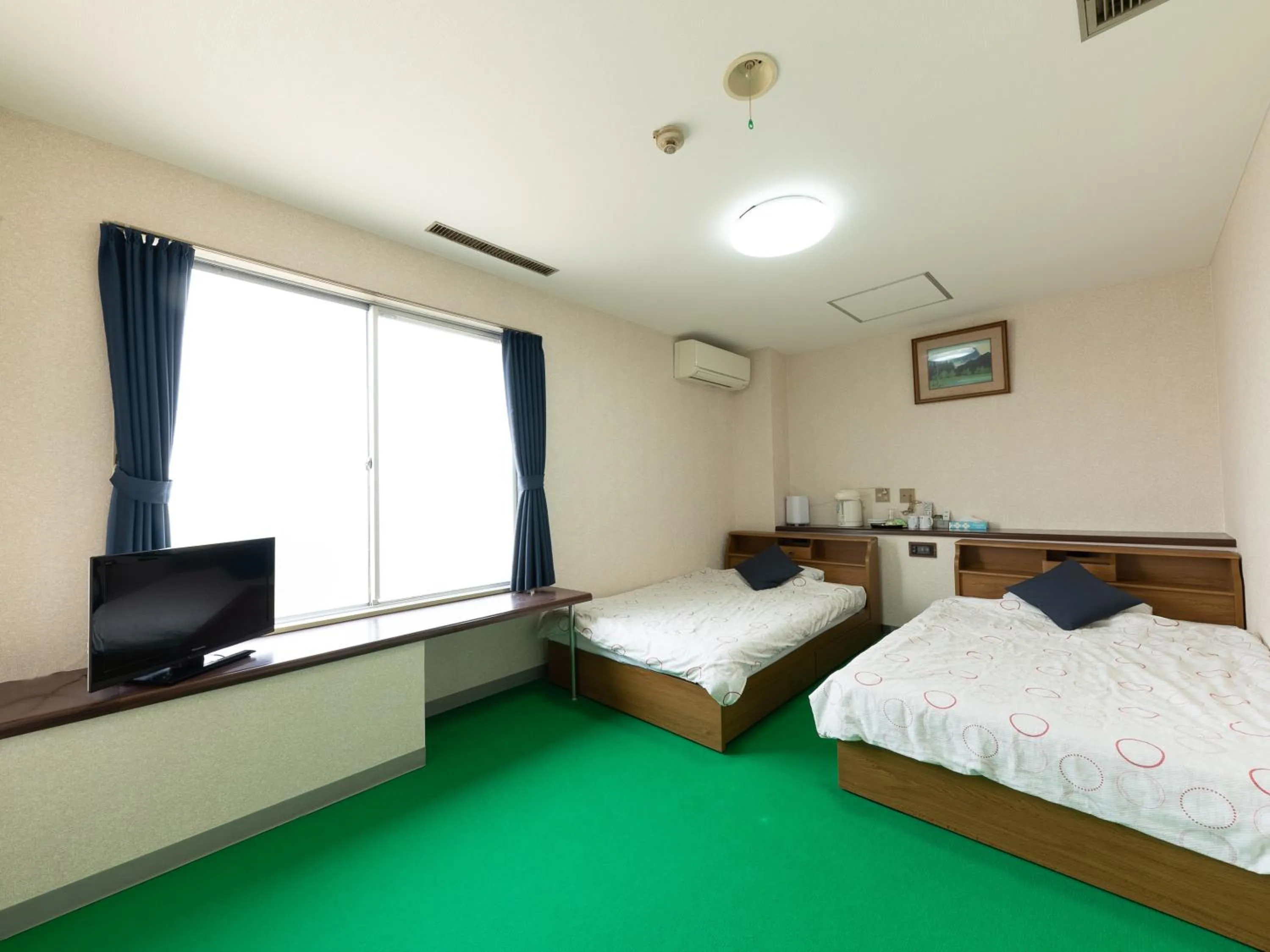 Bed in Tabist Business Hotel Chitose Kashiwazaki
