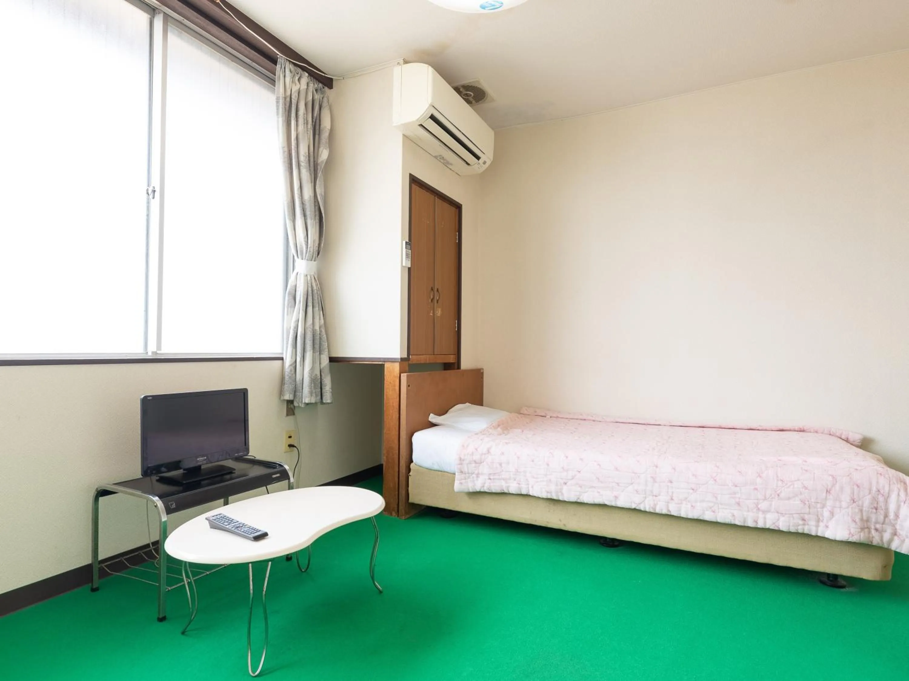 Bed in Tabist Business Hotel Chitose Kashiwazaki