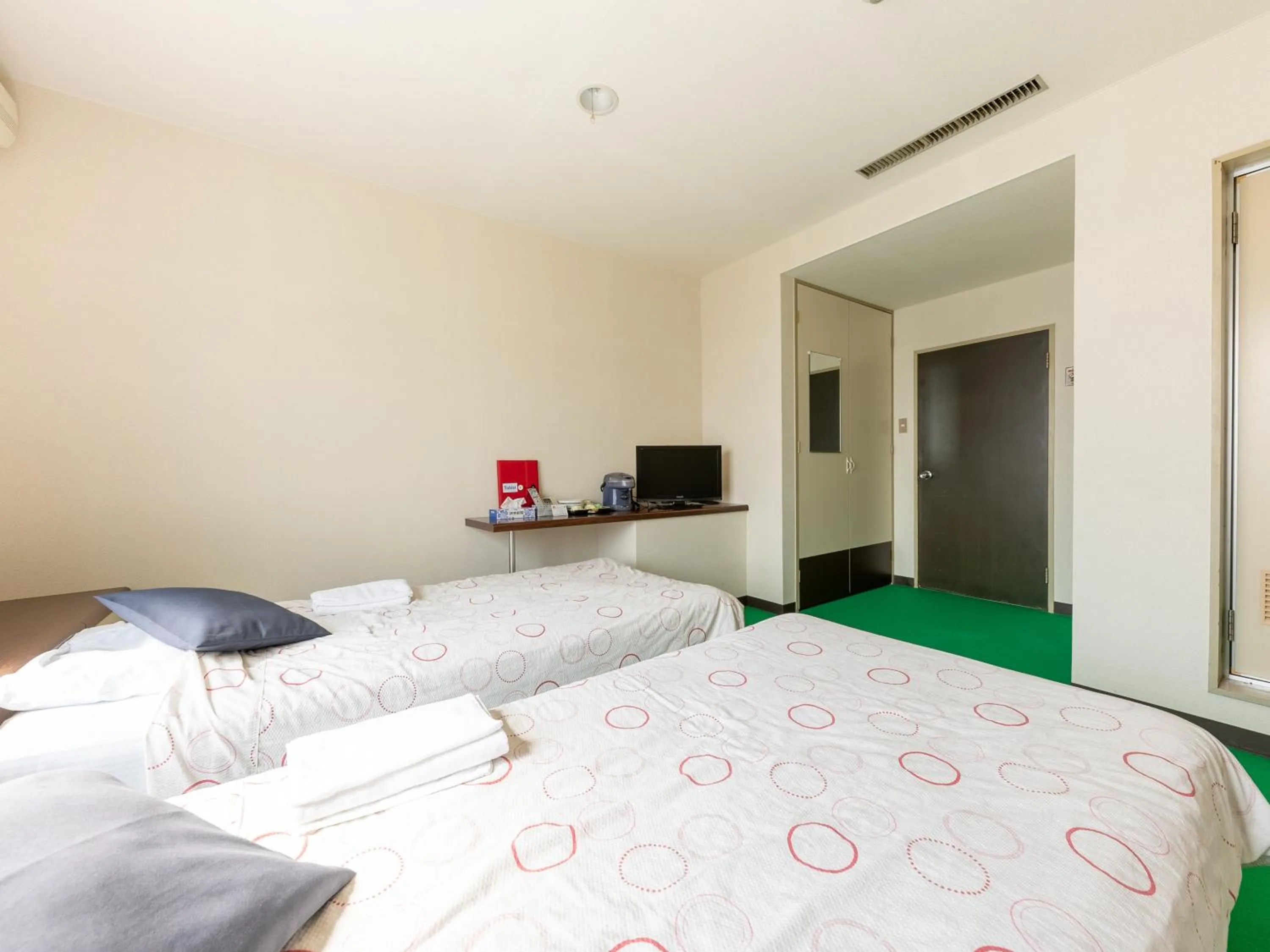 Bed in Tabist Business Hotel Chitose Kashiwazaki