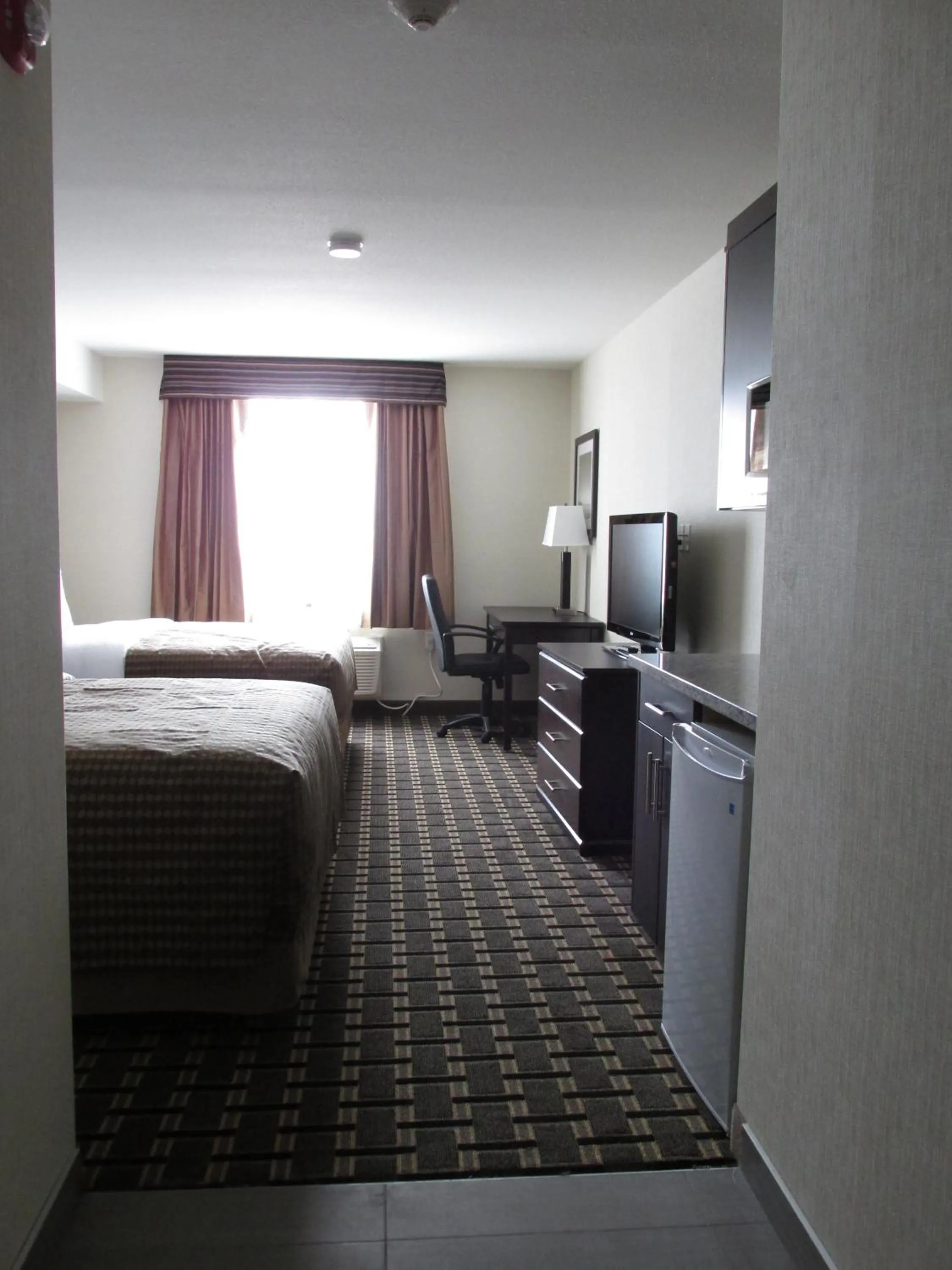 Photo of the whole room, Bed in Sigma Inn & Suites