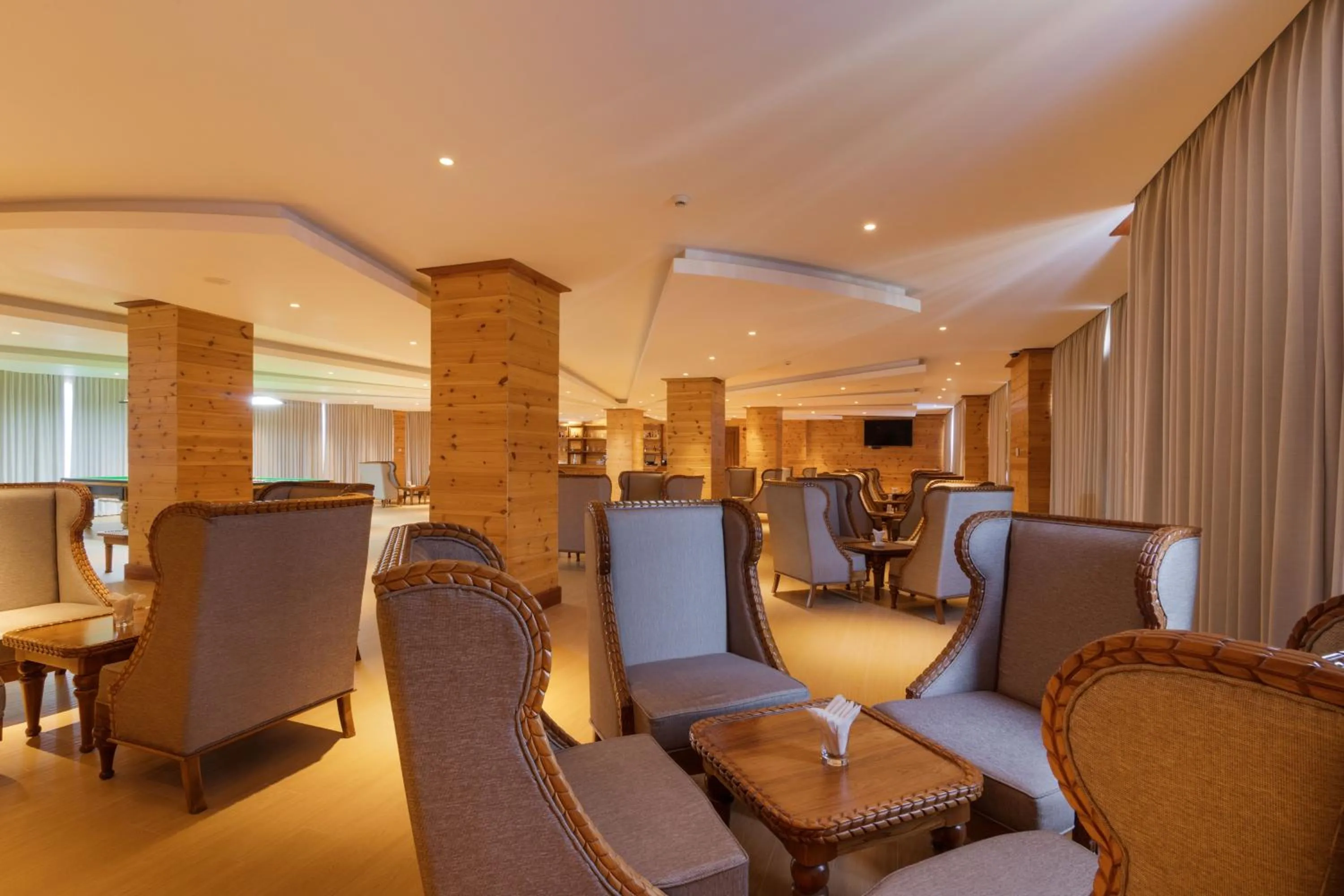 Lounge or bar in Araliya Red - Budget friendly Hotel- Where you find stunning 360 panoramic view of Nuwara Eliya