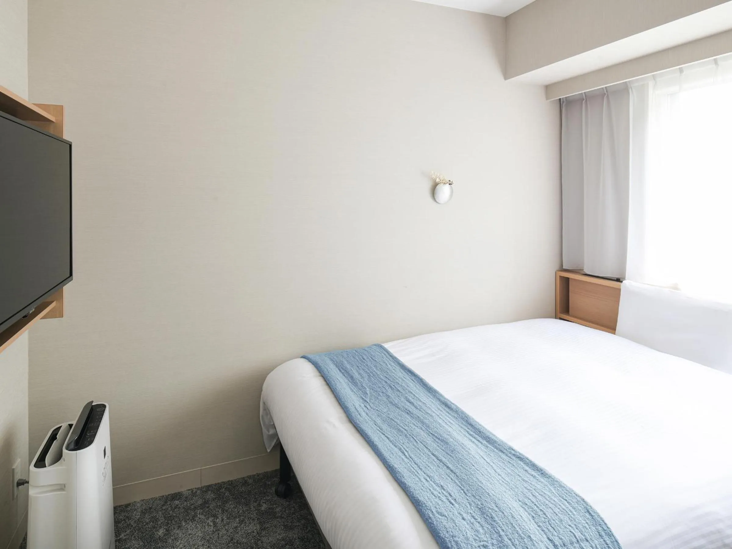 Bed in REF Kyoto Hachijoguchi by VESSEL HOTELS