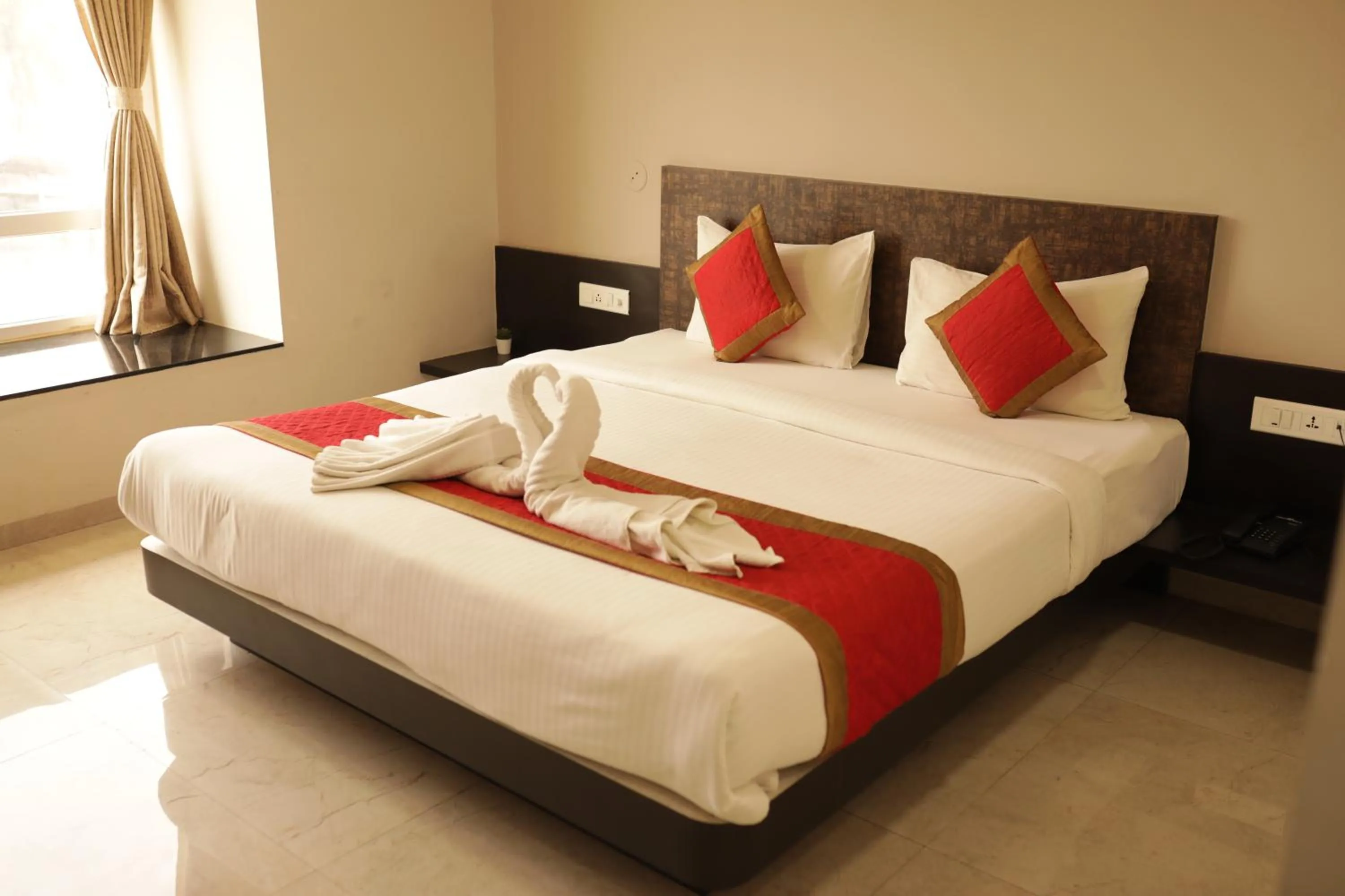 Bed in Hotel Rahul Palace Belgaum