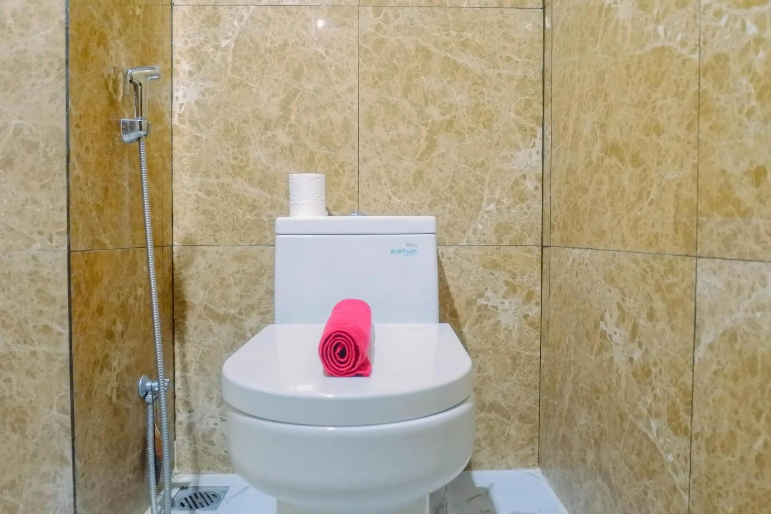 Bathroom in Lavish 2BR Apartment at Grand Sungkono Lagoon By Travelio