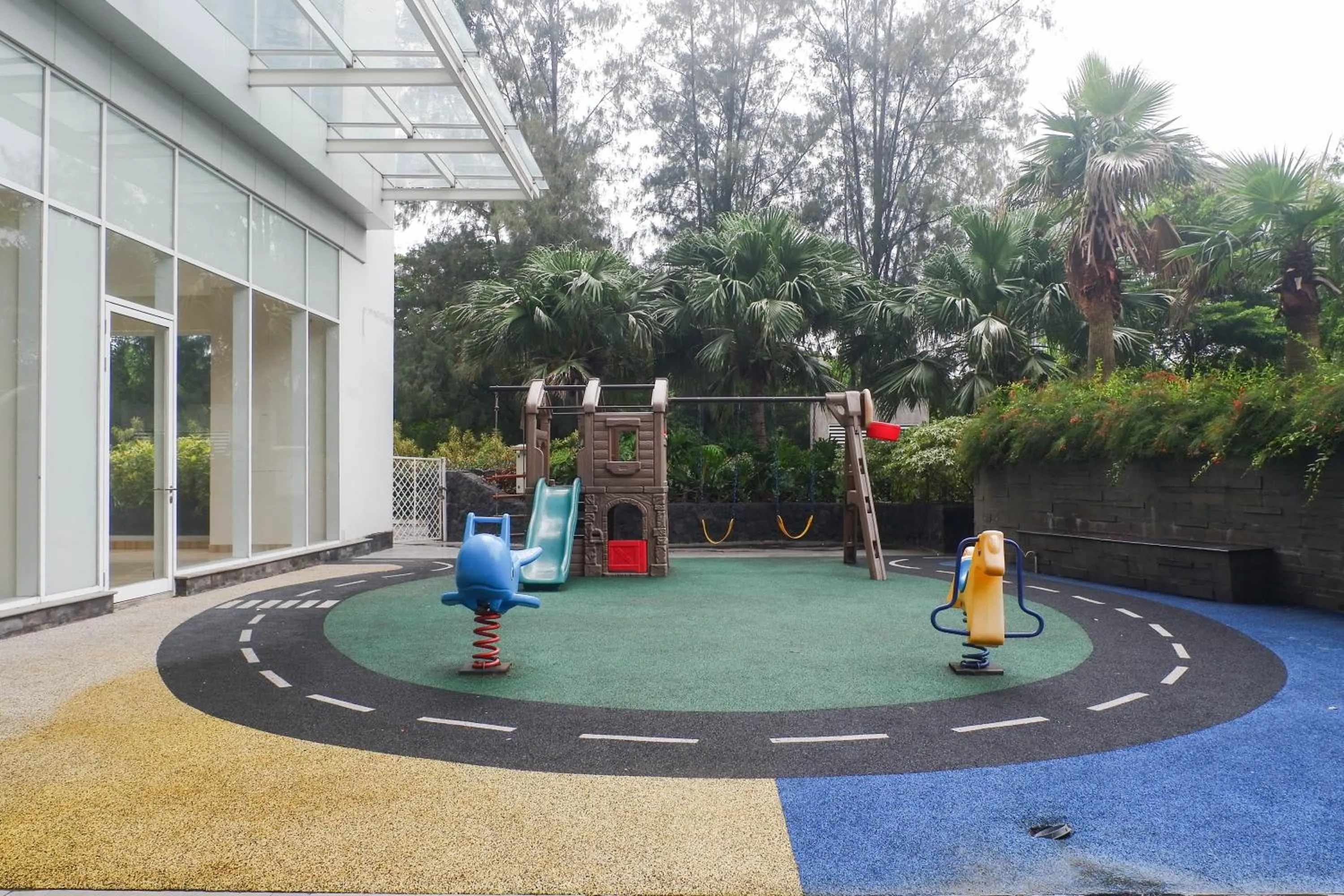 Children play ground in Lavish 2BR Apartment at Grand Sungkono Lagoon By Travelio
