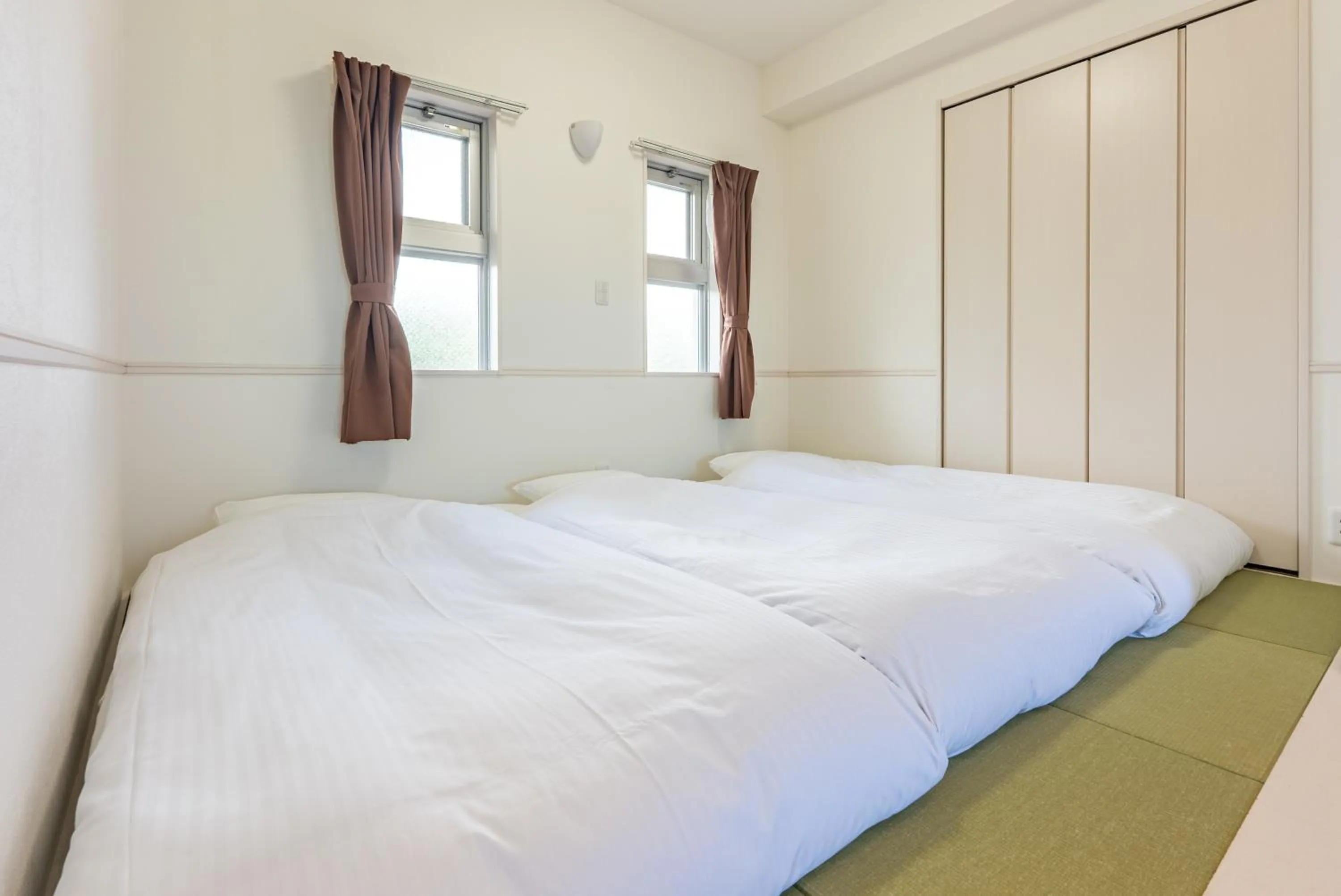 Bed in Odysis Onna Resort Hotel