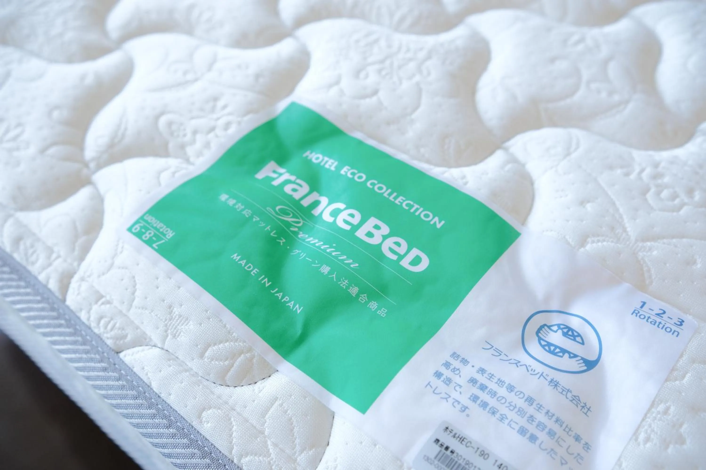 Bed in Odysis Onna Resort Hotel