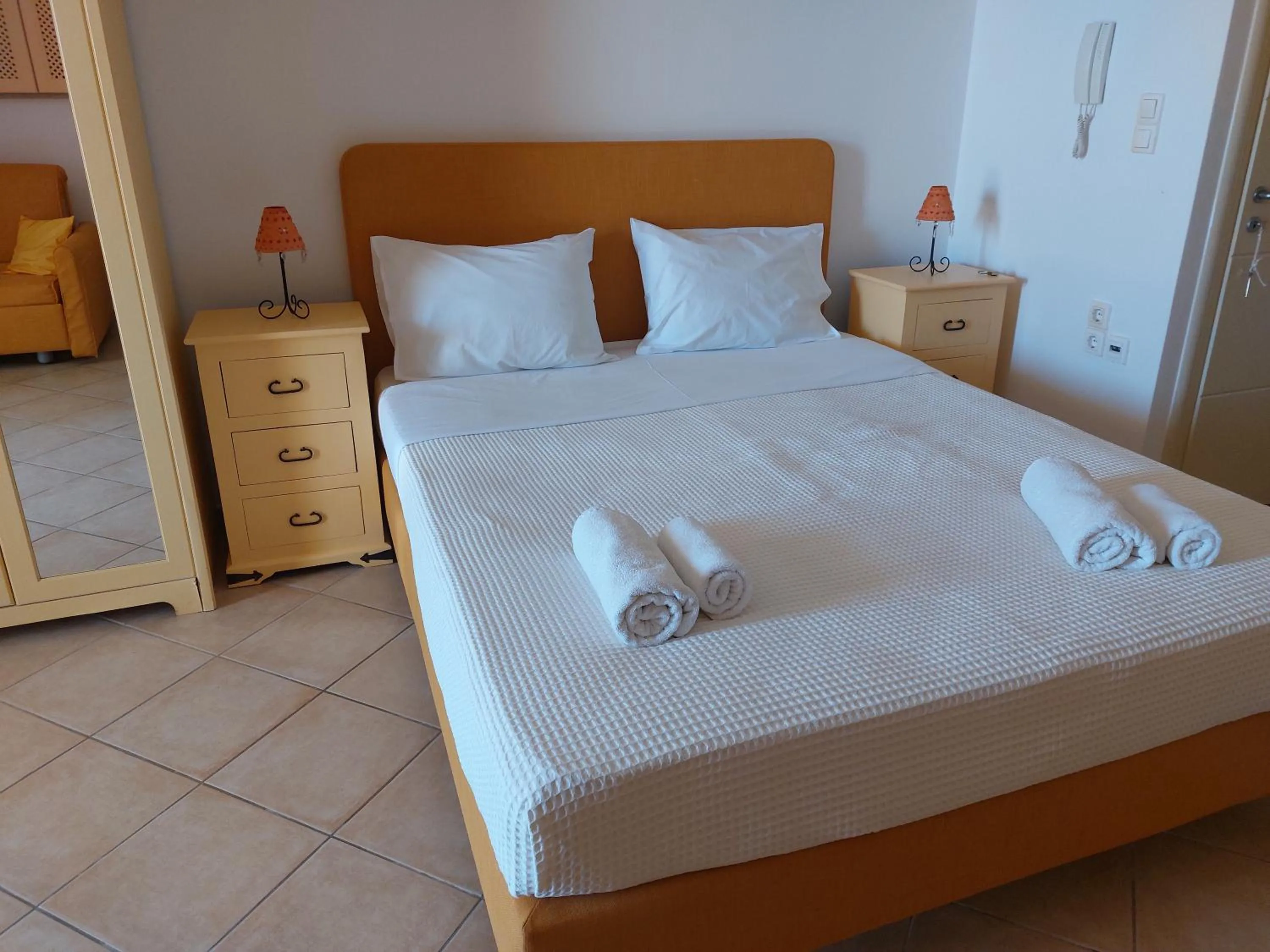 Bed in PLEIADES lUXURY APARTMENTS
