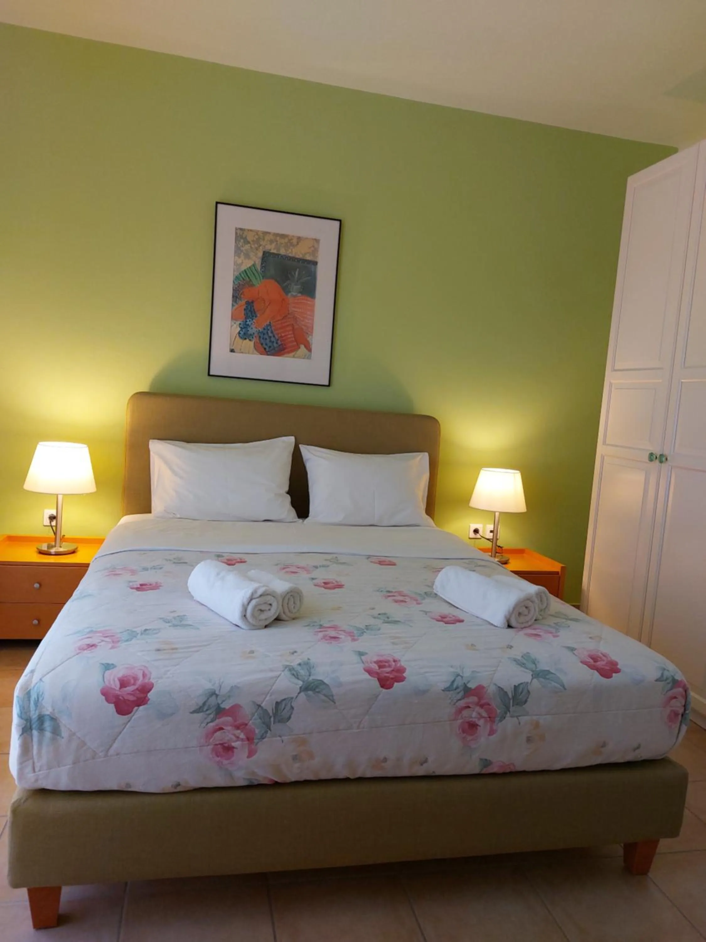 Bed in PLEIADES lUXURY APARTMENTS