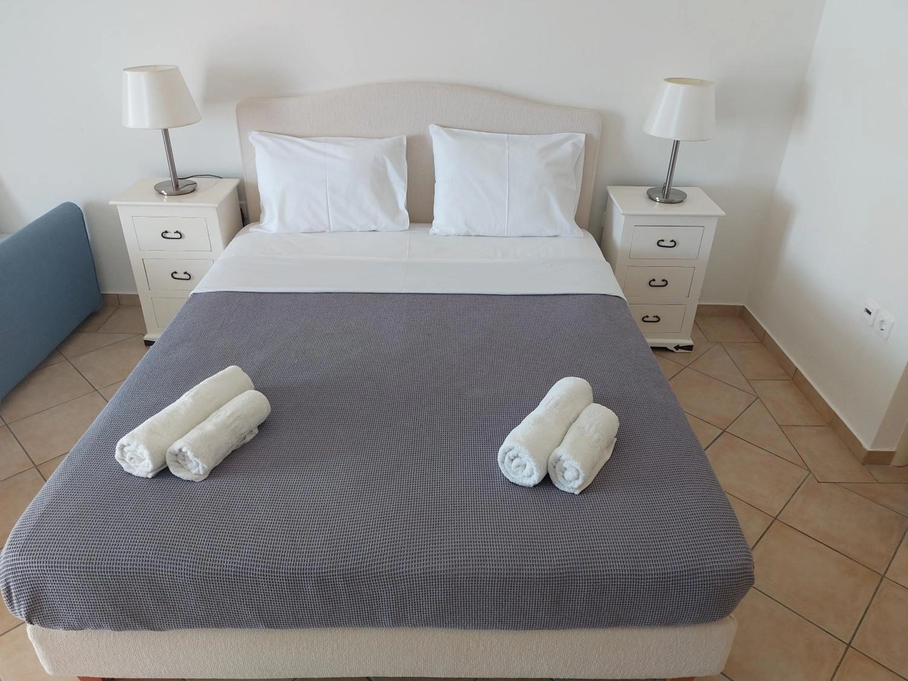 Bed in PLEIADES lUXURY APARTMENTS